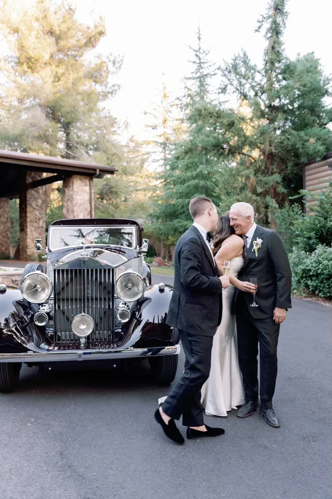 bride hugging father for limo gift