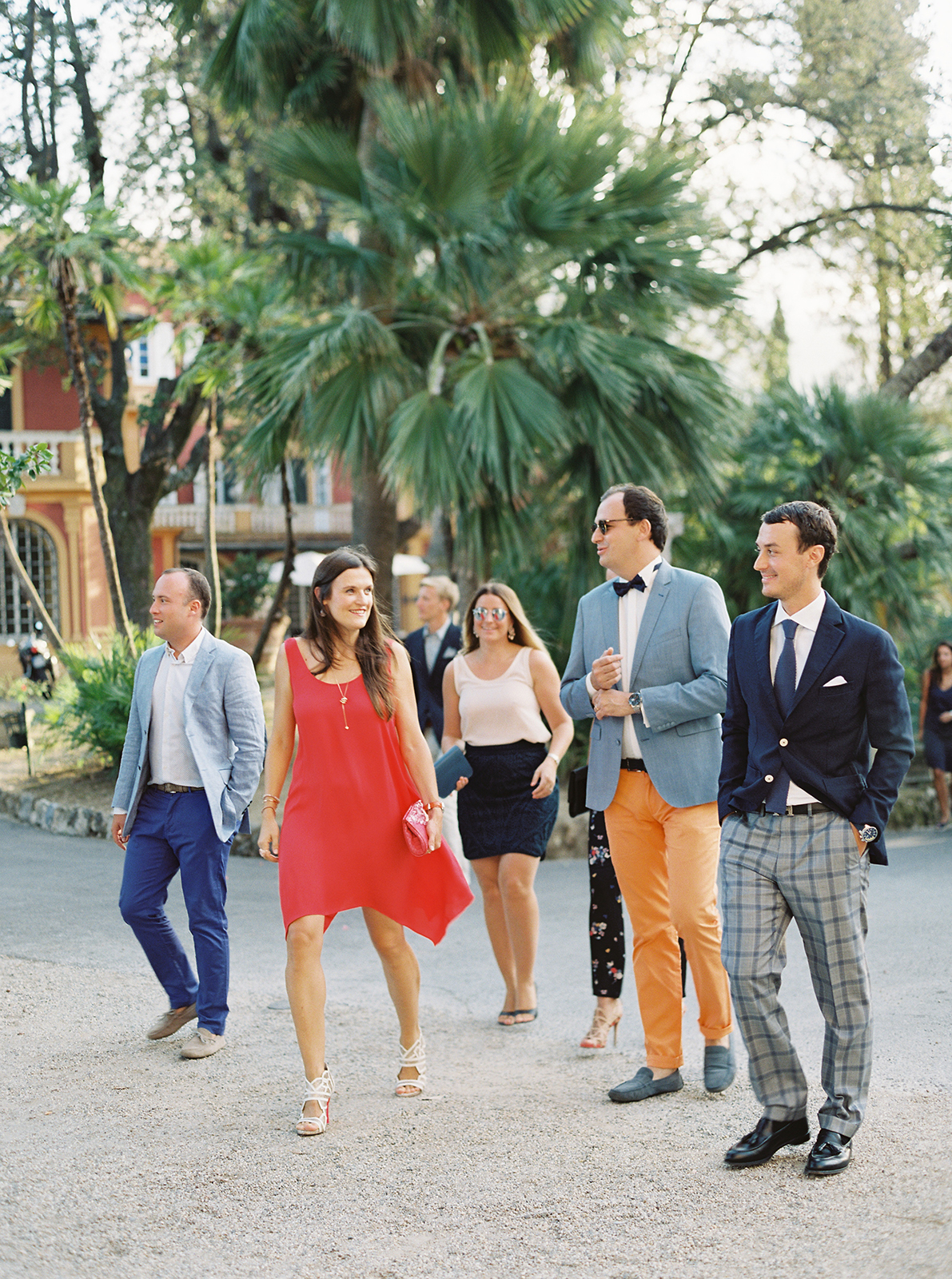Elegant wedding guests walking through Villa