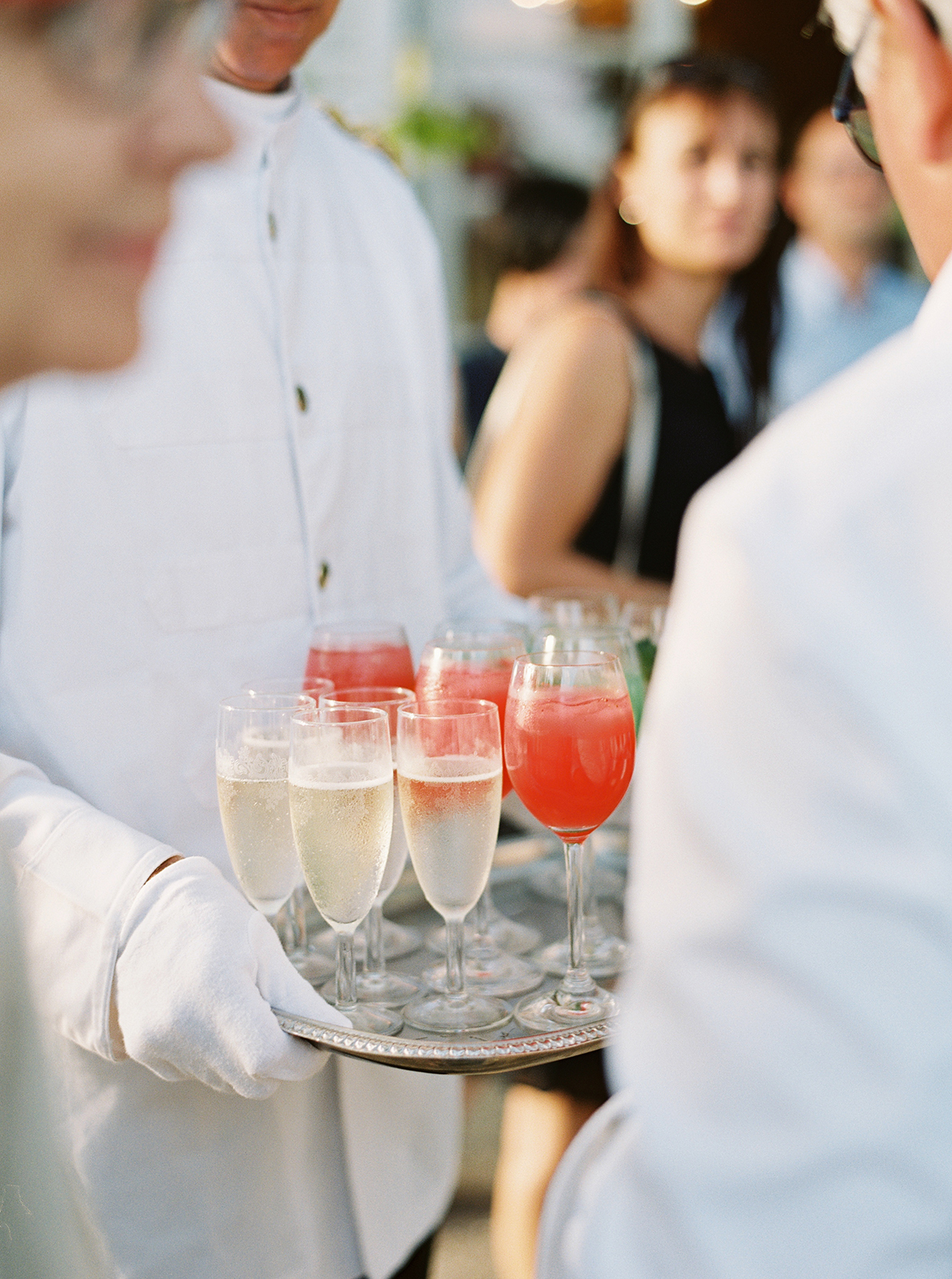 Waiters serving champagne and signature cocktails during welcome dinner