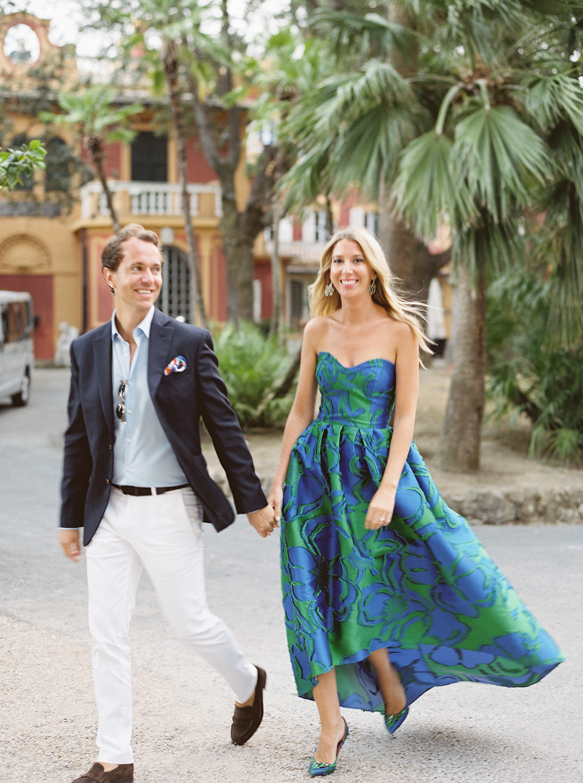 Elegant couple strolling through Villa Durazzo gardens in Santa Margherita Ligure before wedding festivities