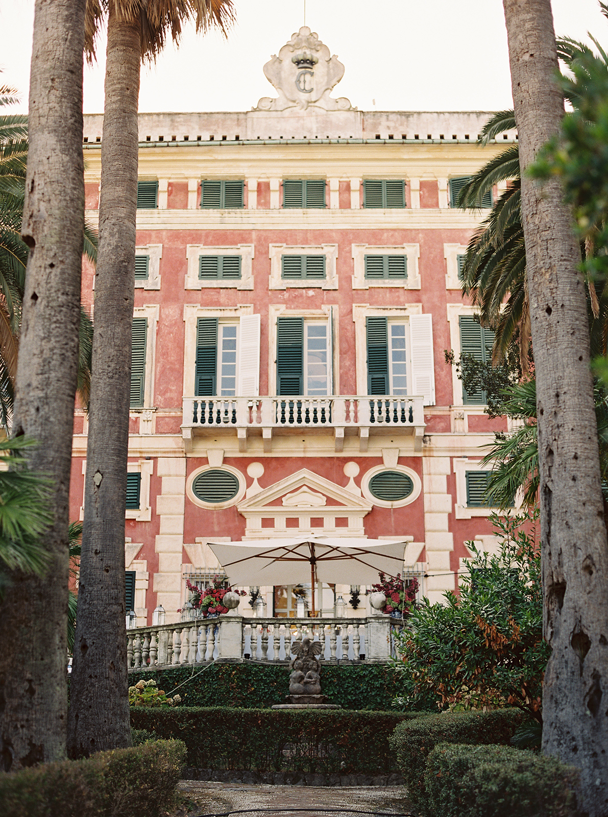 Villa Durazzo garden terrace with palm trees and historic architecture in Santa Margherita Ligure