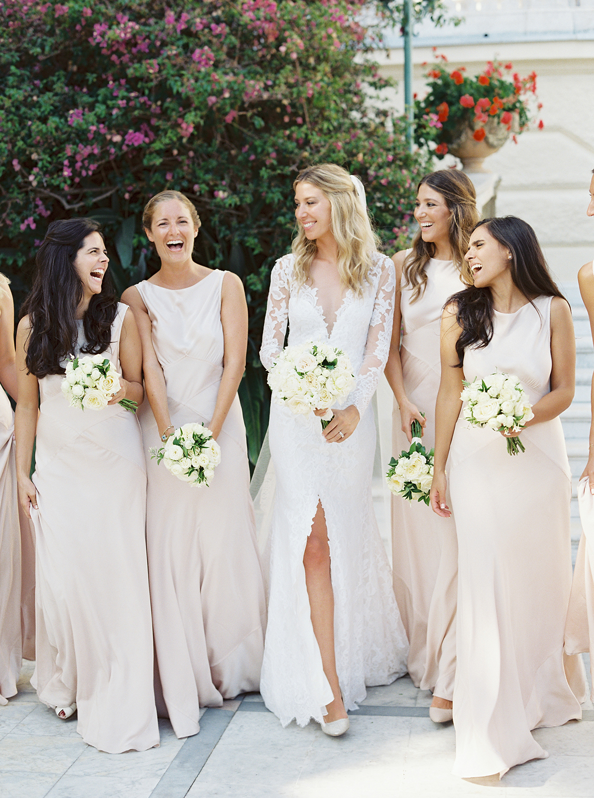 Bride walking with bridesmaids in blush dresses at Imperiale Palace Hotel Portofino wedding