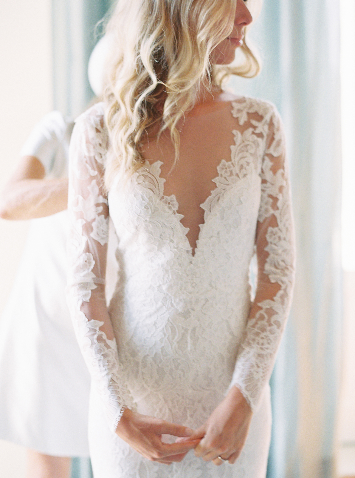 Bride standing in natural window light during getting ready at Imperiale Palace Hotel in Portofino