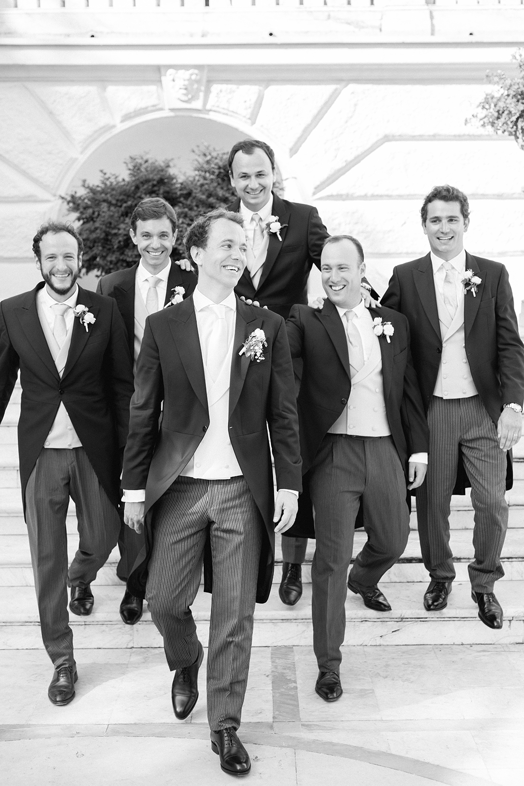 Black and white portrait of groom and groomsmen at Imperiale Palace Hotel in Portofino