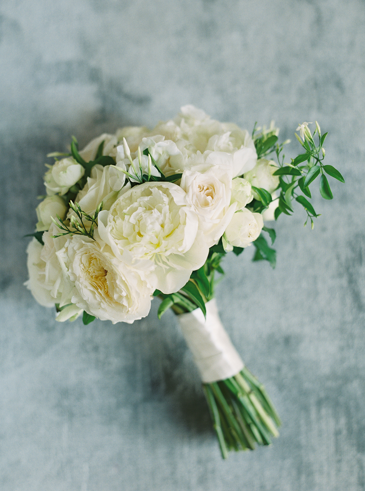 White bridal bouquet with garden roses photographed at Imperiale Palace Hotel in Portofino
