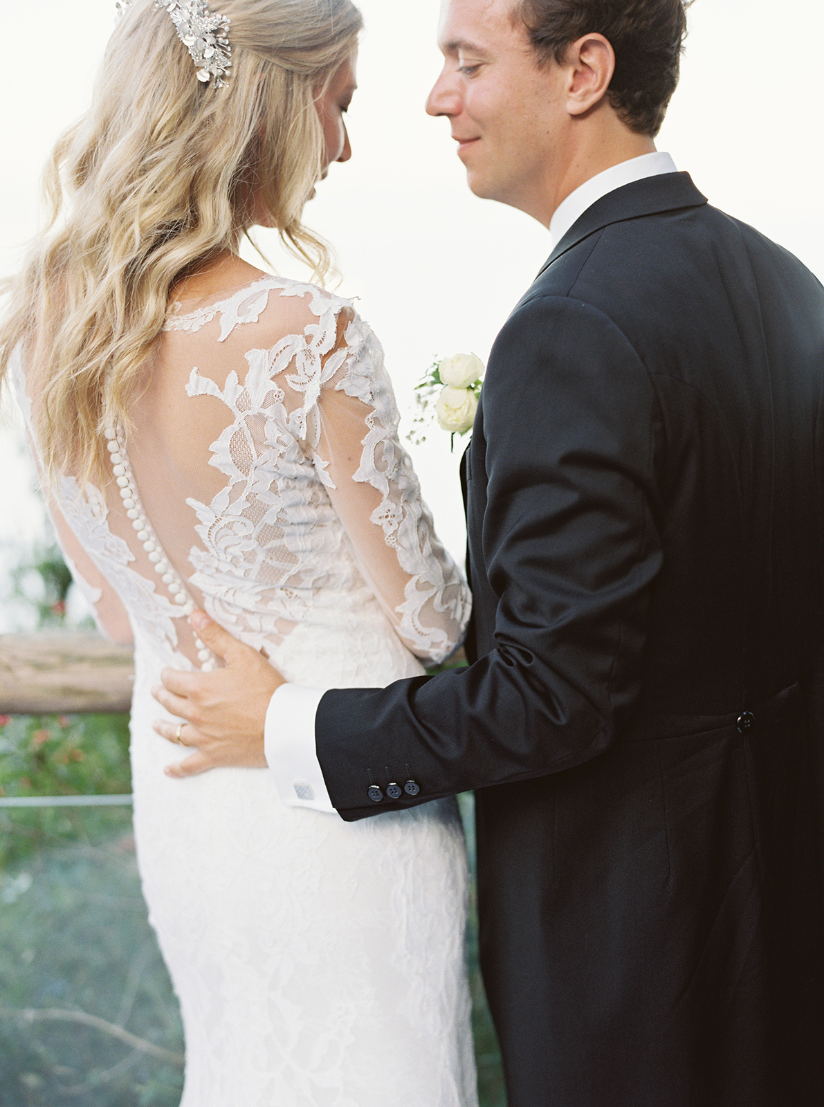 Romantic close-up of bride and groom embracing at La Cervara wedding in Portofino