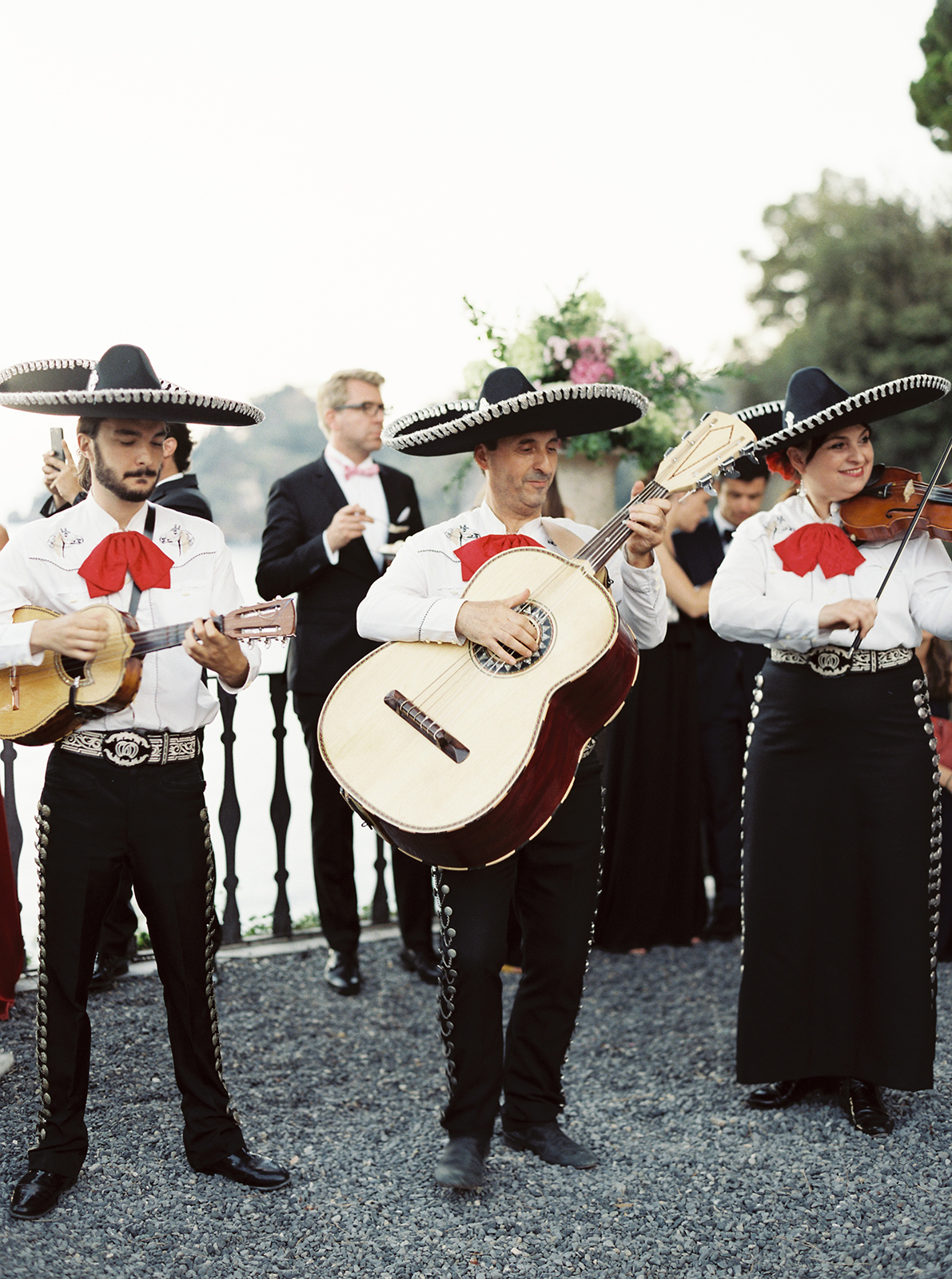 Live musicians performing during a destination wedding celebration in Italy