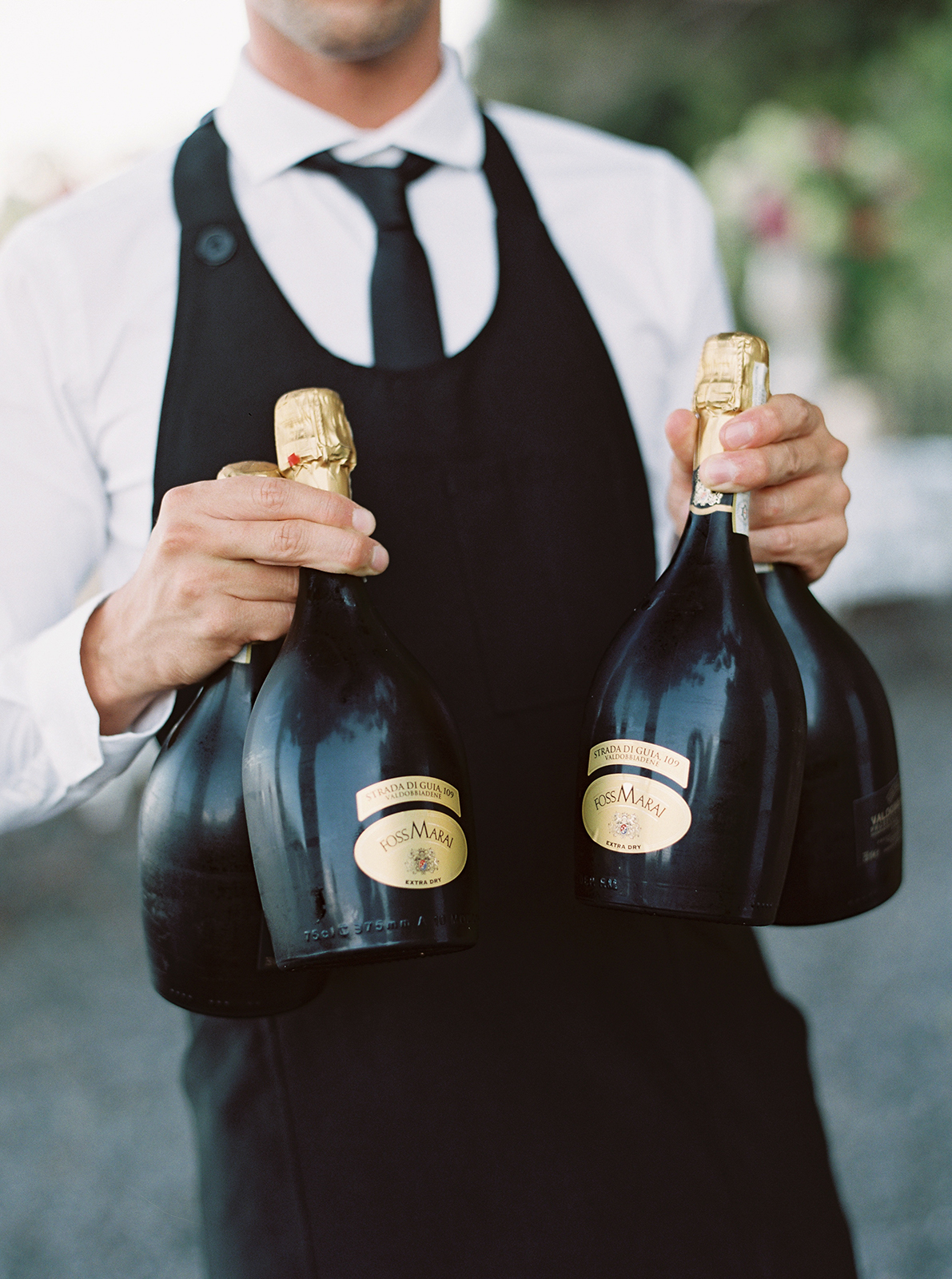 Wedding champagne service at La Cervara Abbey in Portofino with Italian sparkling wine bottles