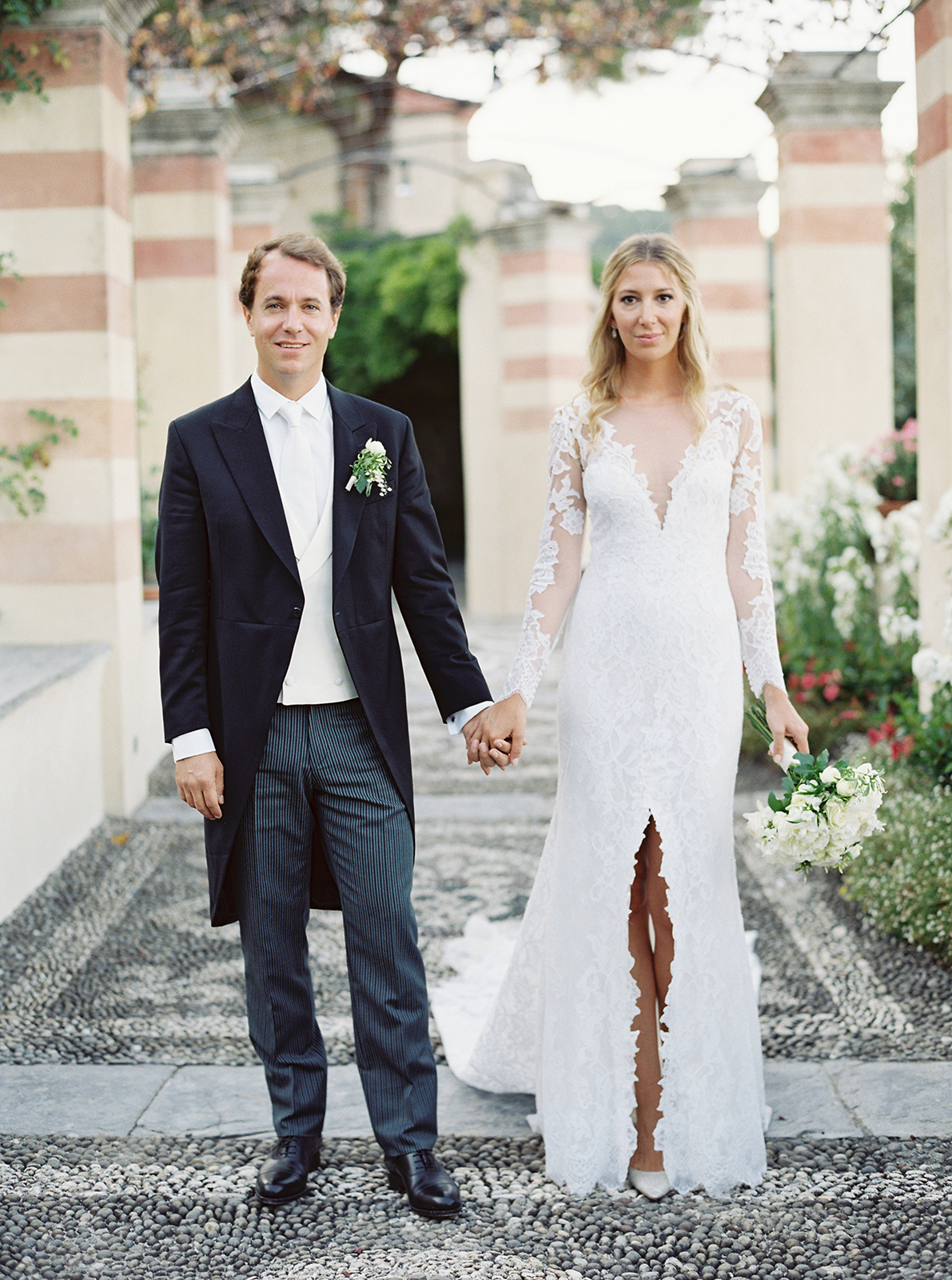 Bride and groom holding hands at La Cervara Abbey wedding in Portofino