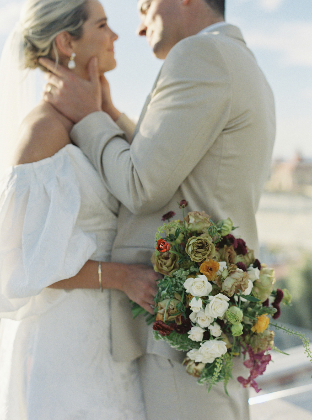 Wedding couple embracing with bouquet during Casa de Sierra Nevada Belmond Hotel wedding