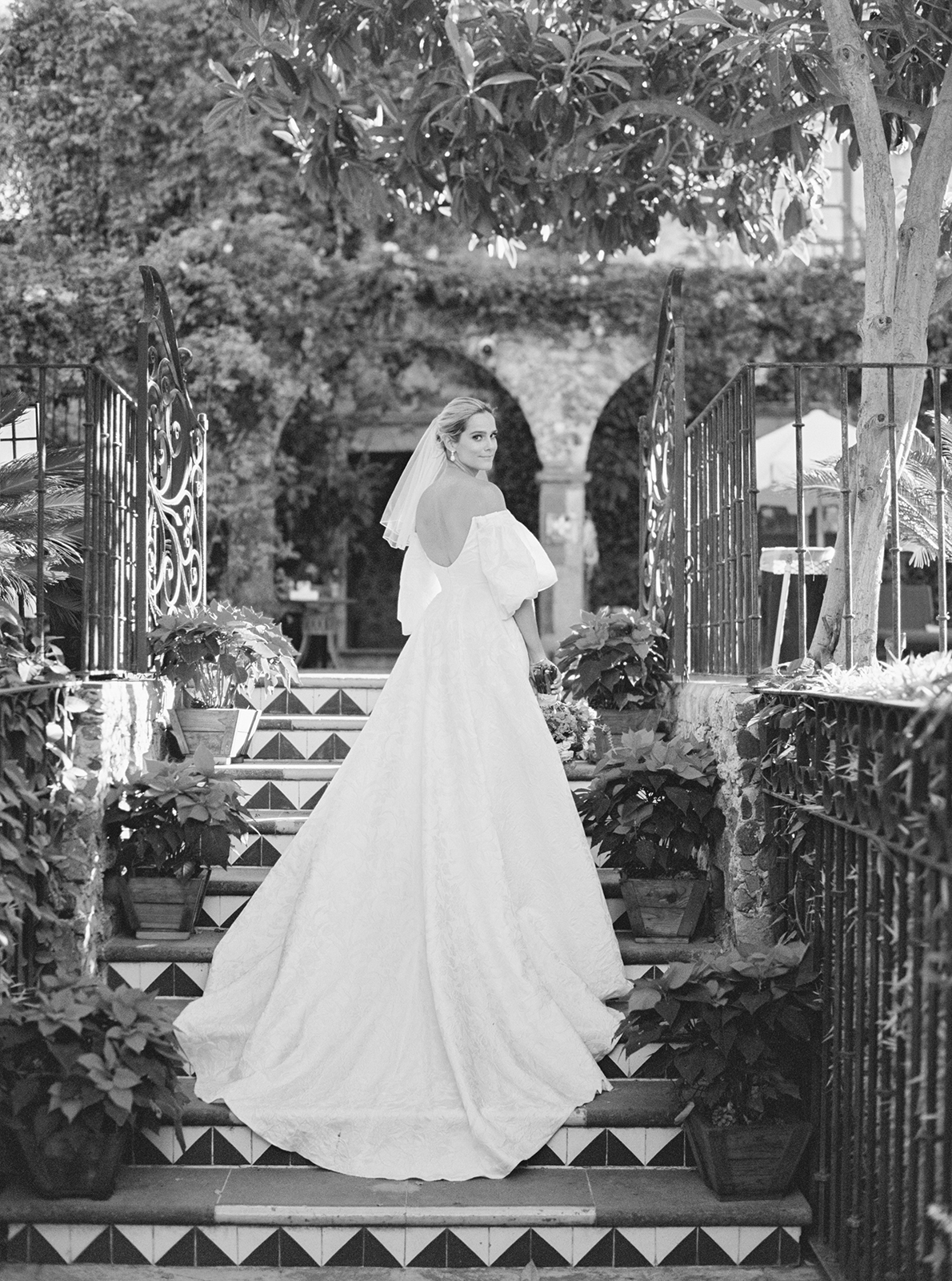 Bride standing on tiled steps at Casa de Sierra Nevada Belmond Hotel