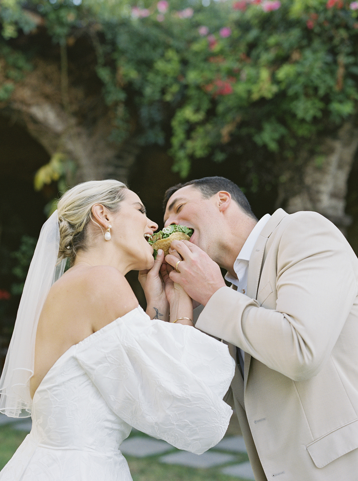 Wedding couple sharing a taco during reception at Casa de Sierra Nevada Belmond Hotel