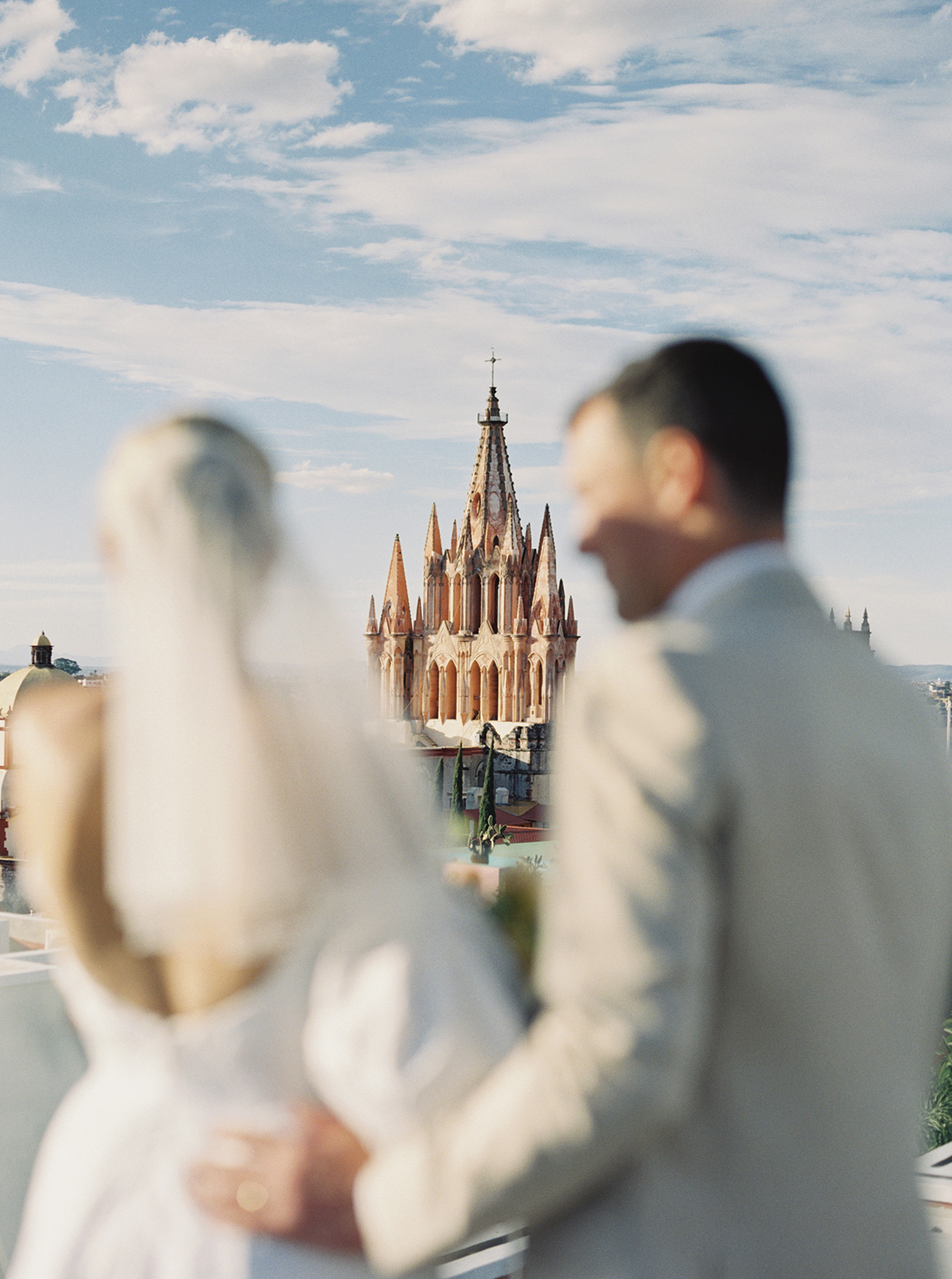 Wedding couple on rooftop overlooking San Miguel de Allende