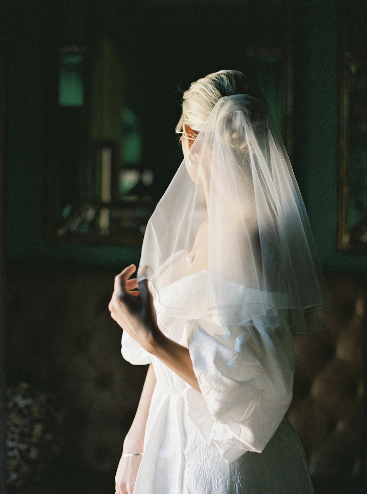 Bride adjusting veil at Casa de Sierra Nevada Belmond Hotel