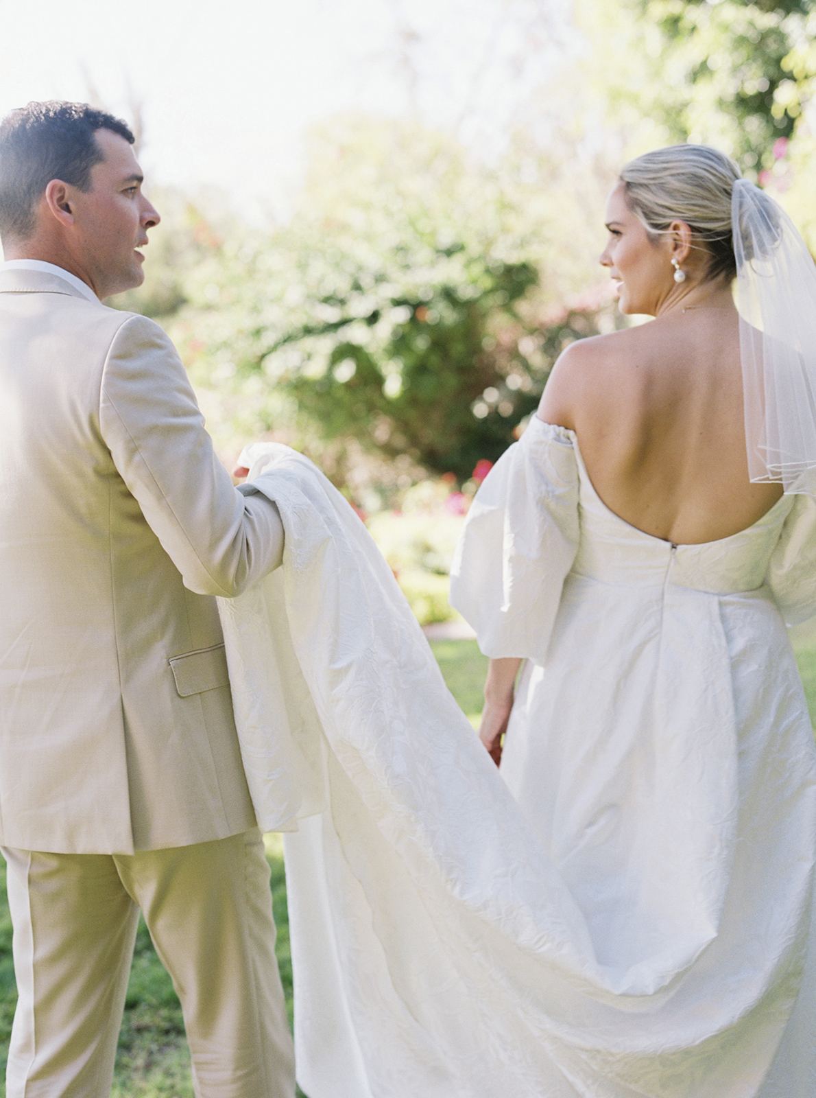 Wedding couple walking through garden at Casa de Sierra Nevada Belmond Hotel