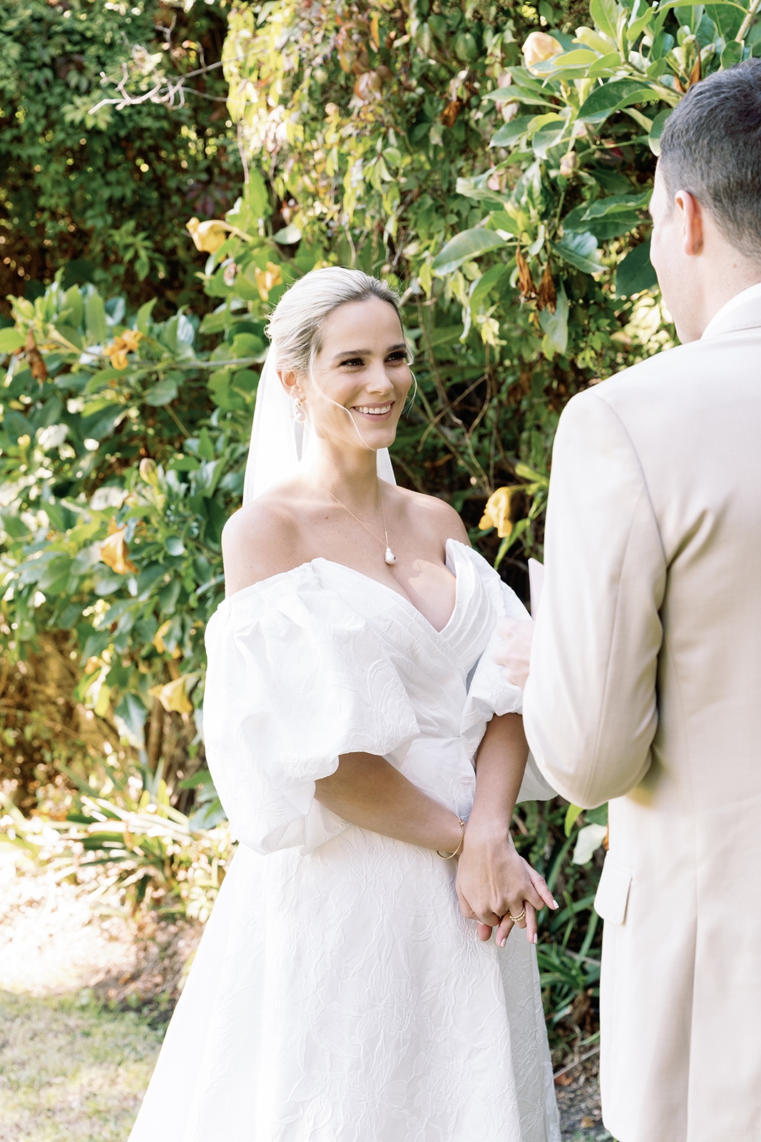 Bride smiling during outdoor wedding ceremony at Casa de Sierra Nevada