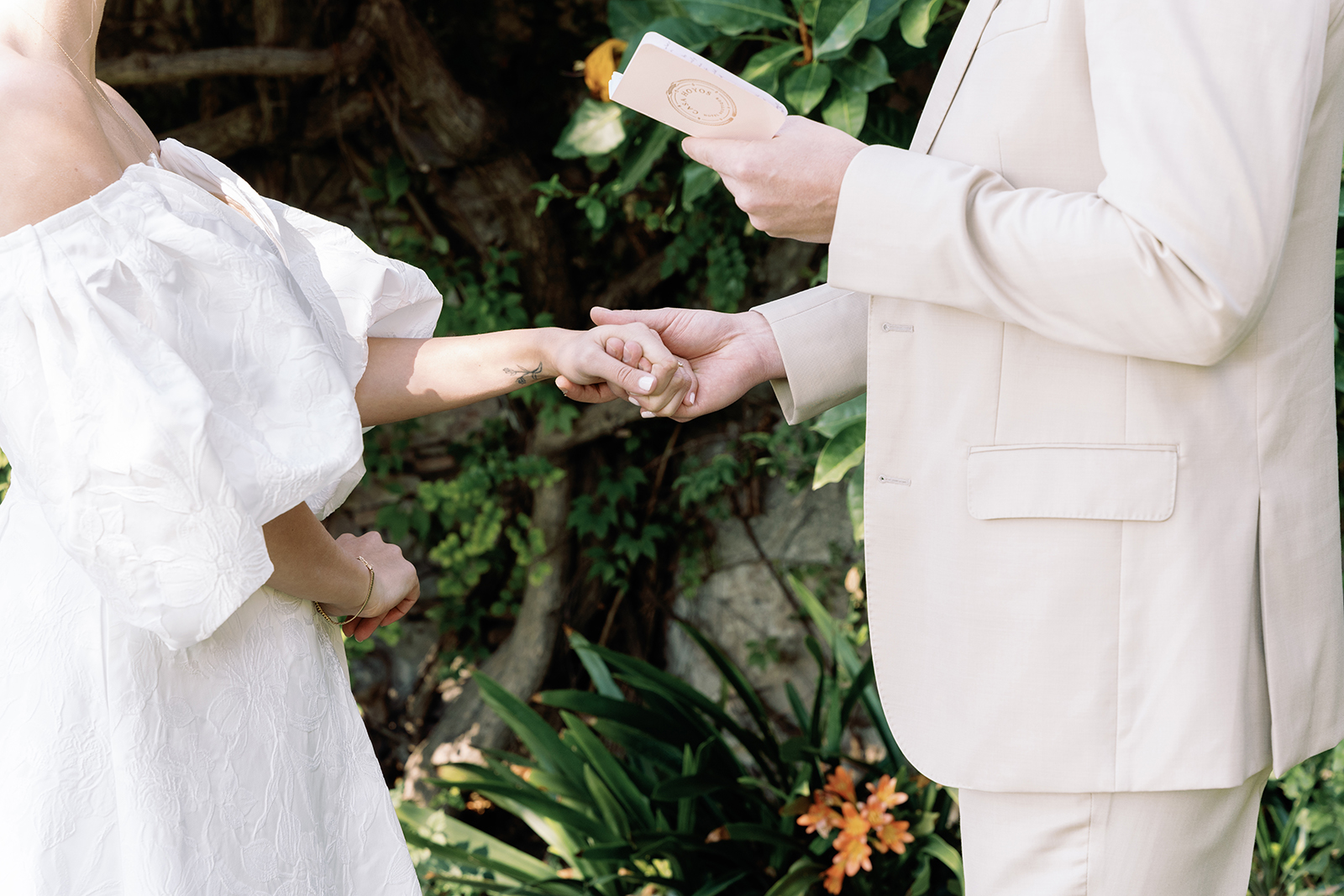 Couple holding hands during wedding vows at Casa de Sierra Nevada Belmond Hotel