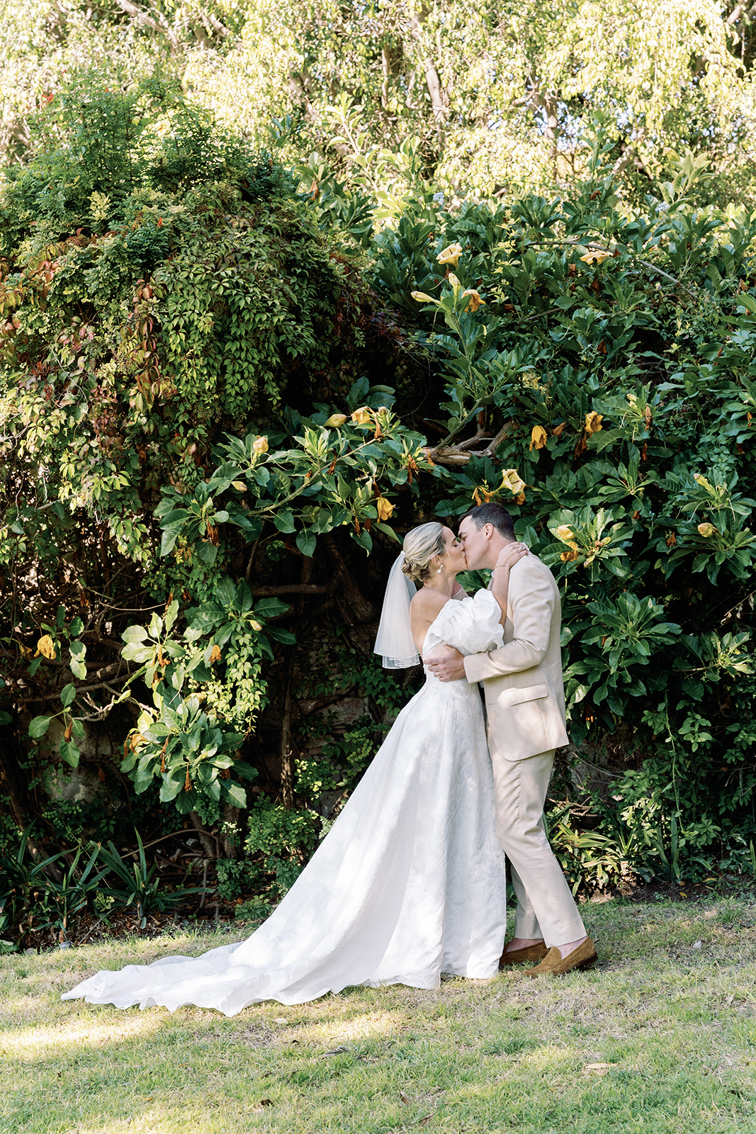 Wedding couple kissing after ceremony at Casa de Sierra Nevada Belmond Hotel
