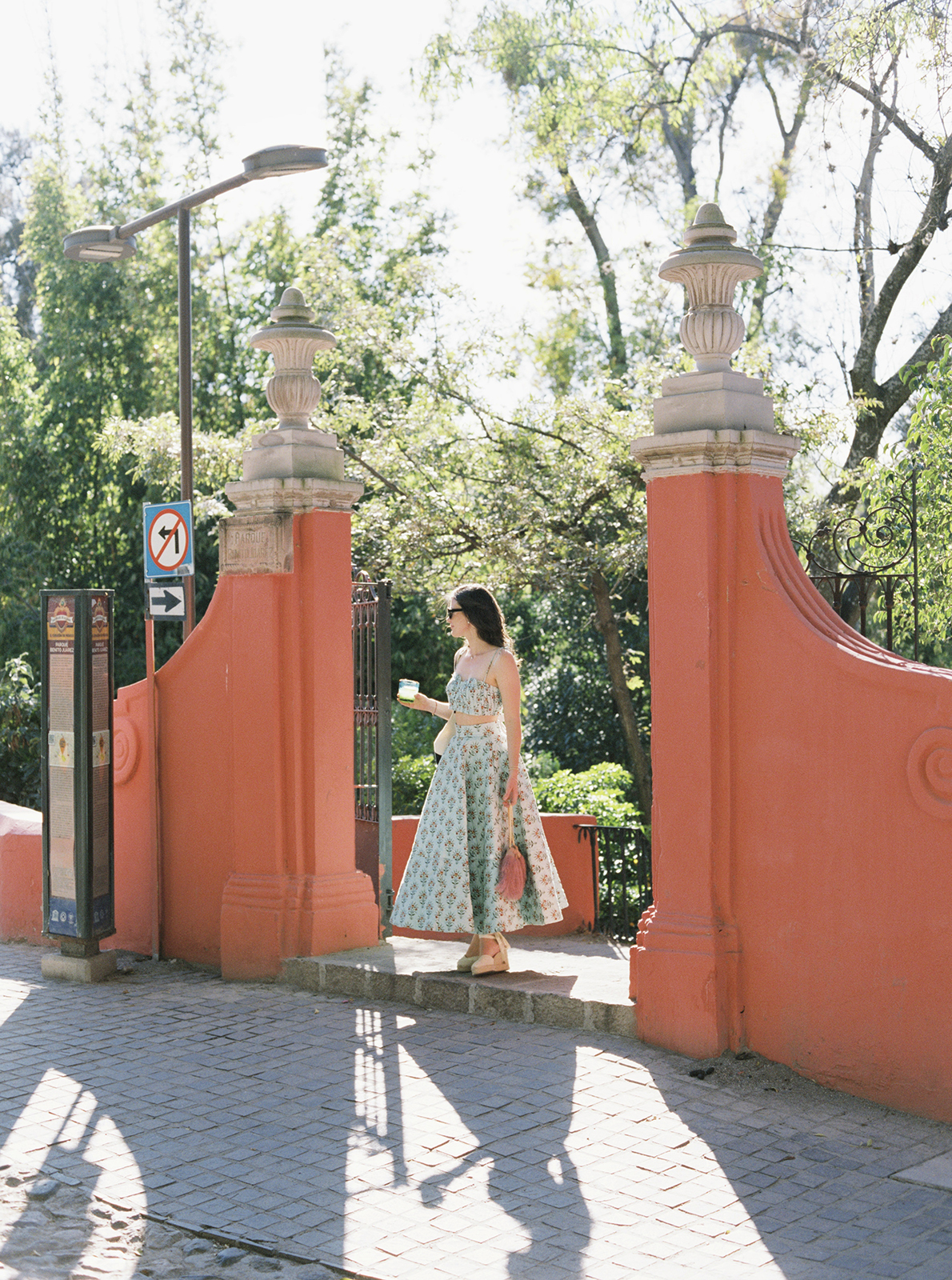 Guest walking through garden entrance at Casa de Sierra Nevada Belmond Hotel