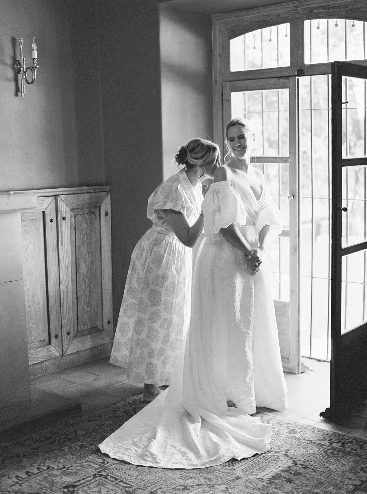 Bride getting into wedding dress at Casa de Sierra Nevada Belmond Hotel