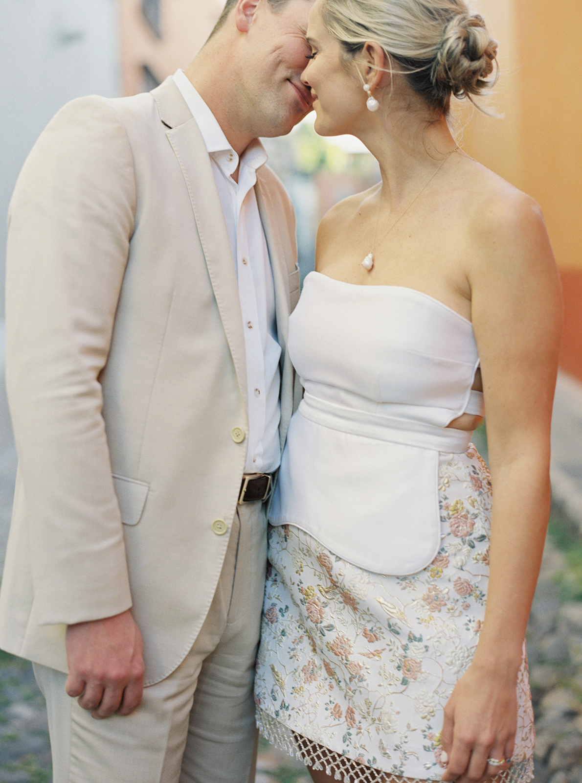 Intimate portrait of wedding couple touching foreheads