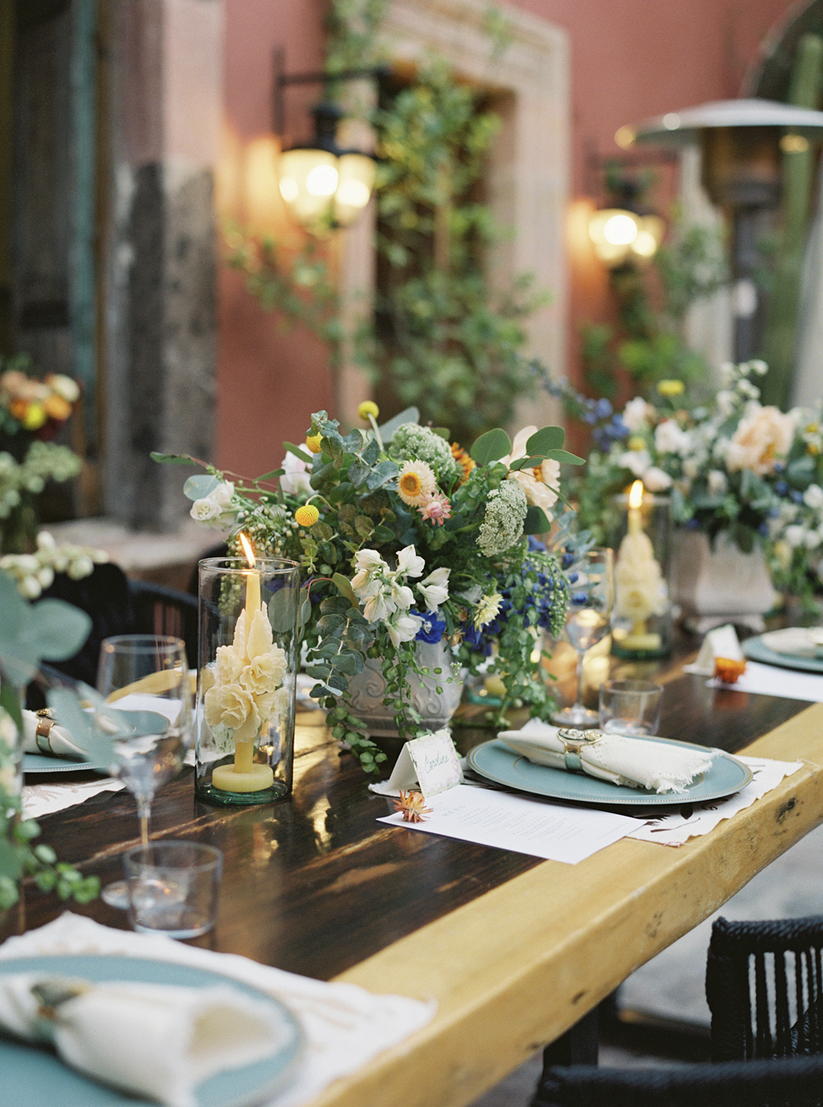 Elegant wedding reception table at Casa Hoyos with floral arrangements, candles, and place settings