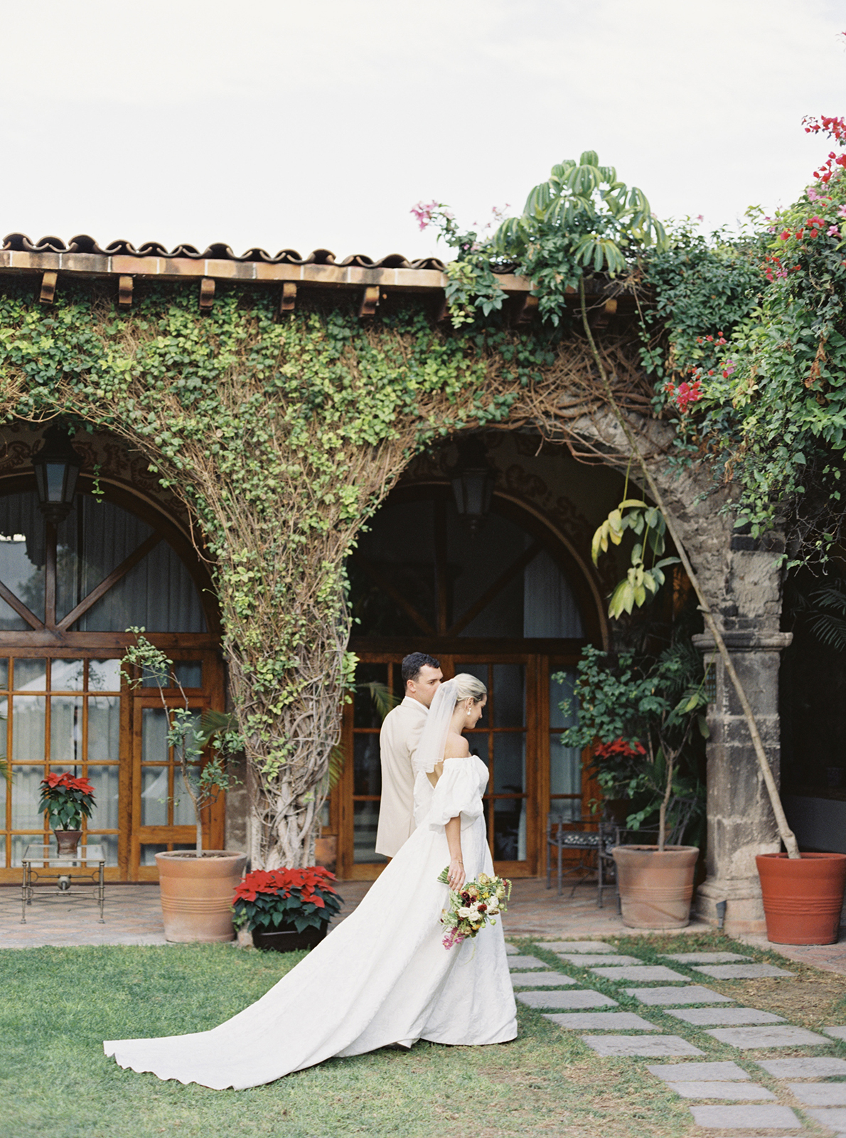 bride and groom walking in garden in casa de Sierra Nevada hotel