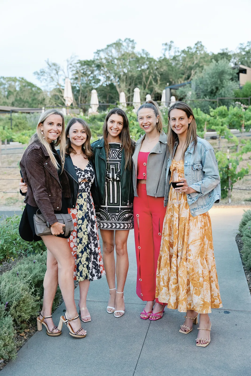 Friends posing together at a relaxed rehearsal dinner celebration in Healdsburg