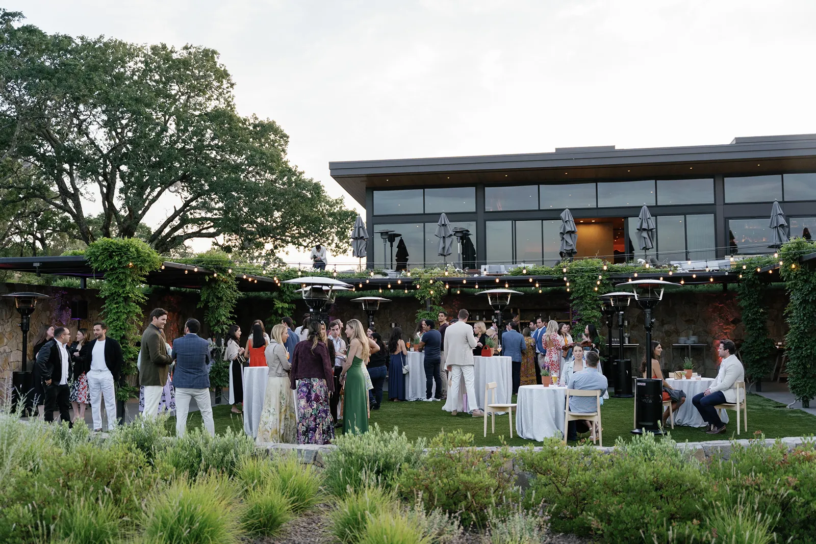 Wide view of guests gathered at an outdoor Montage Healdsburg rehearsal dinner