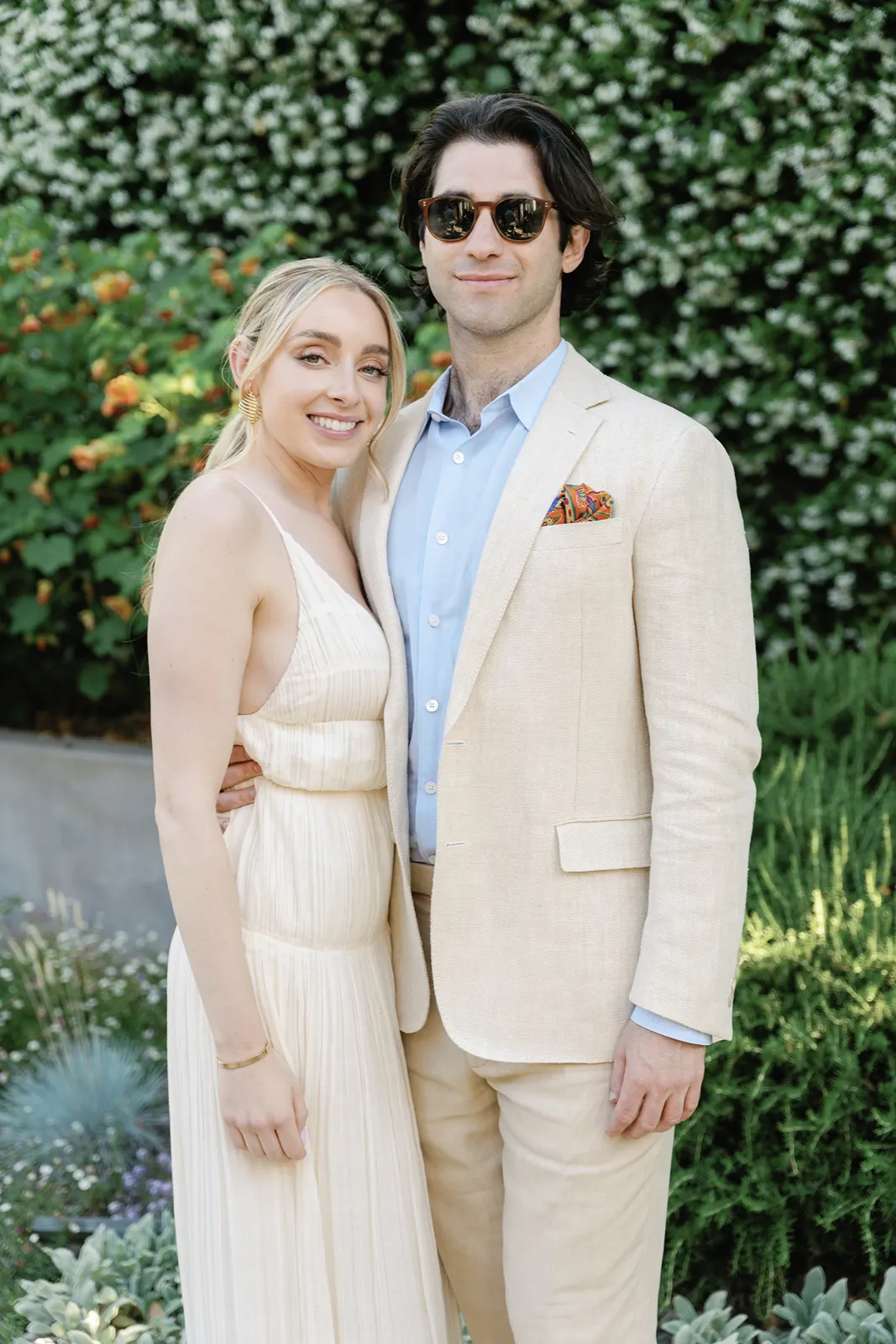 Bride and groom smiling together during portraits at a Sonoma rehearsal dinner