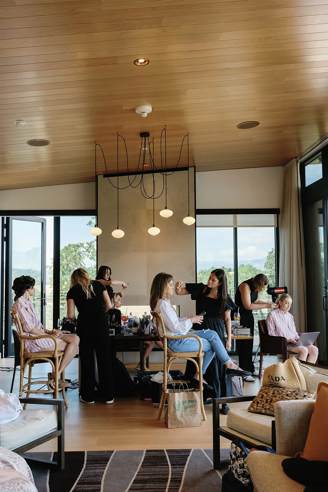 Wedding morning hair and makeup inside a Montage Healdsburg suite with bridesmaids preparing together.