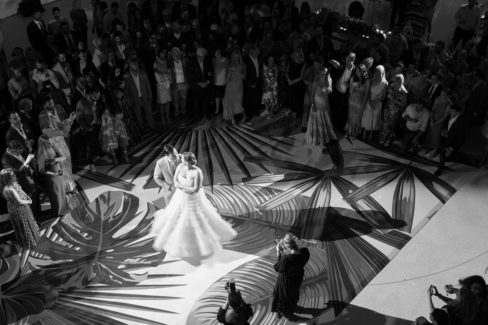 Bride and groom sharing their first dance surrounded by guests during a Faena Miami Beach wedding reception