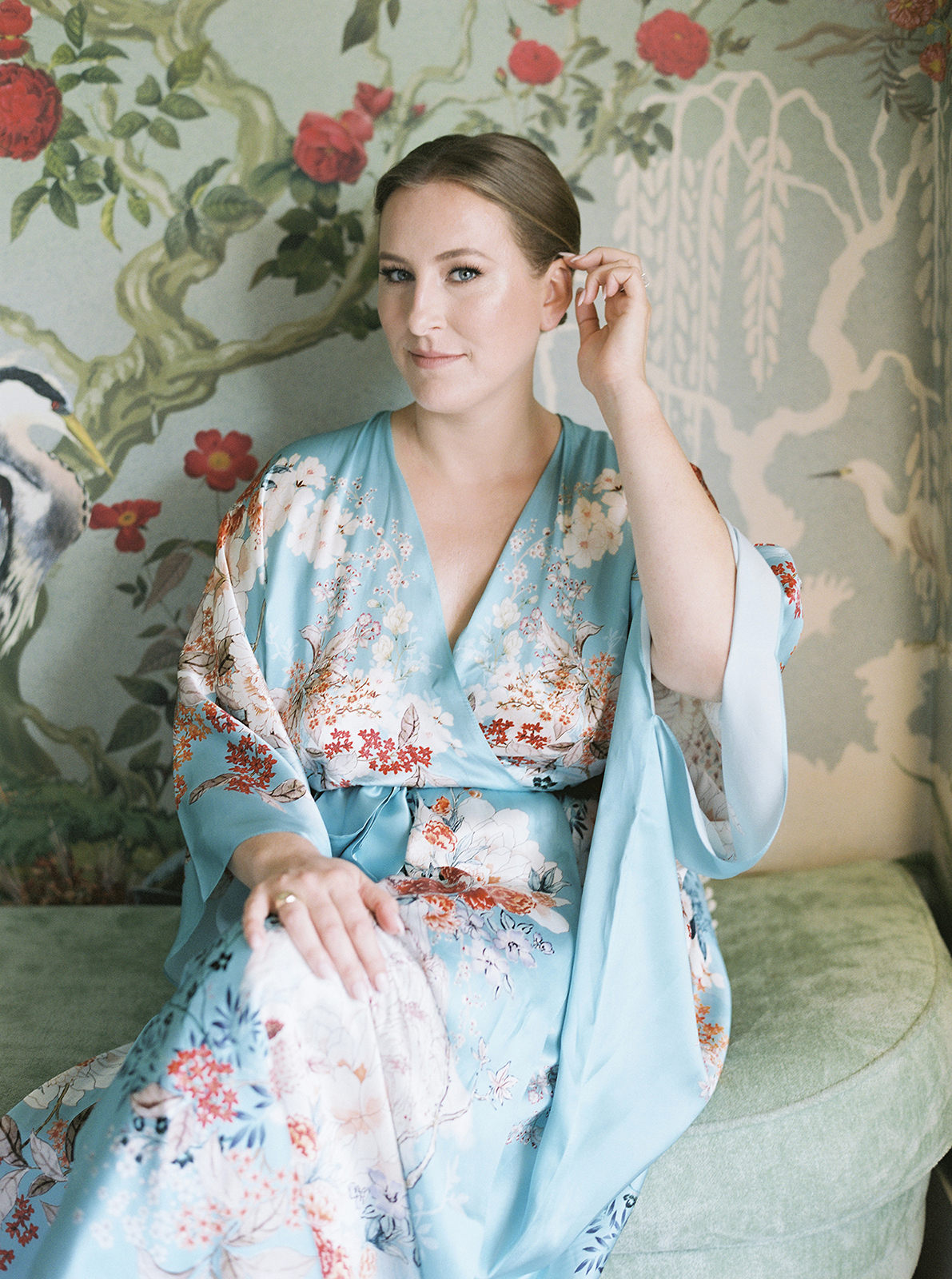 Bride getting ready in a silk robe inside Faena Hotel Miami Beach before her wedding ceremony
