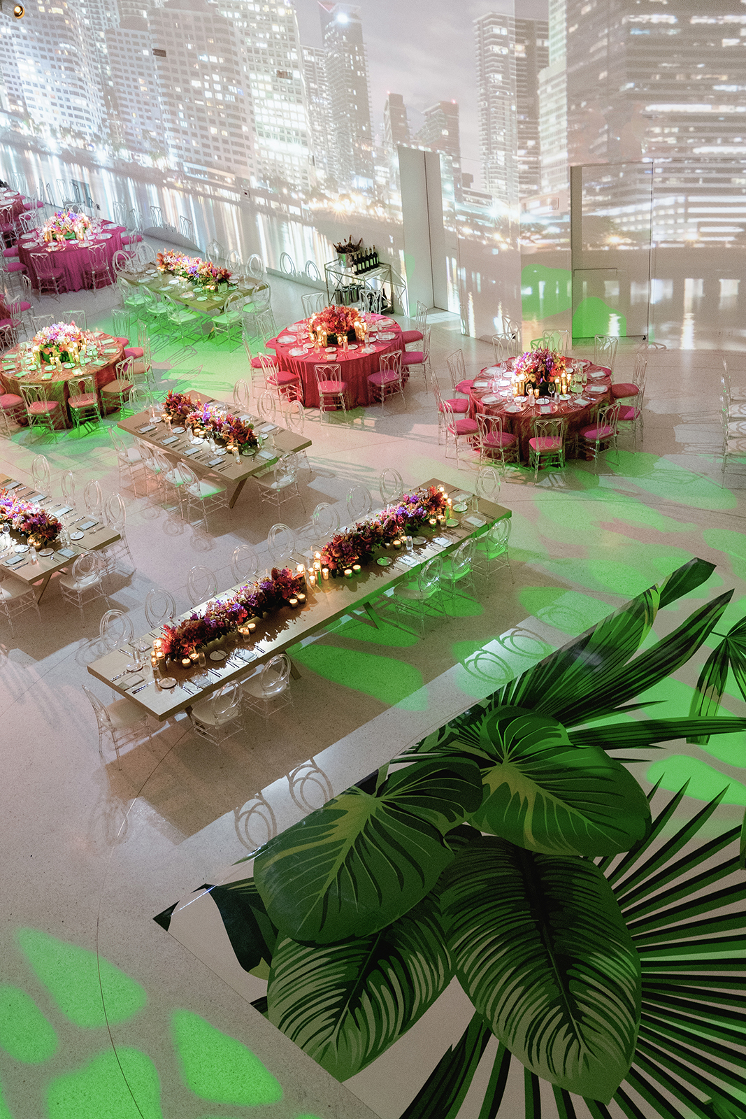 Luxury wedding reception at Faena Hotel Miami Beach with floral tablescapes, modern decor, and cityscape projection