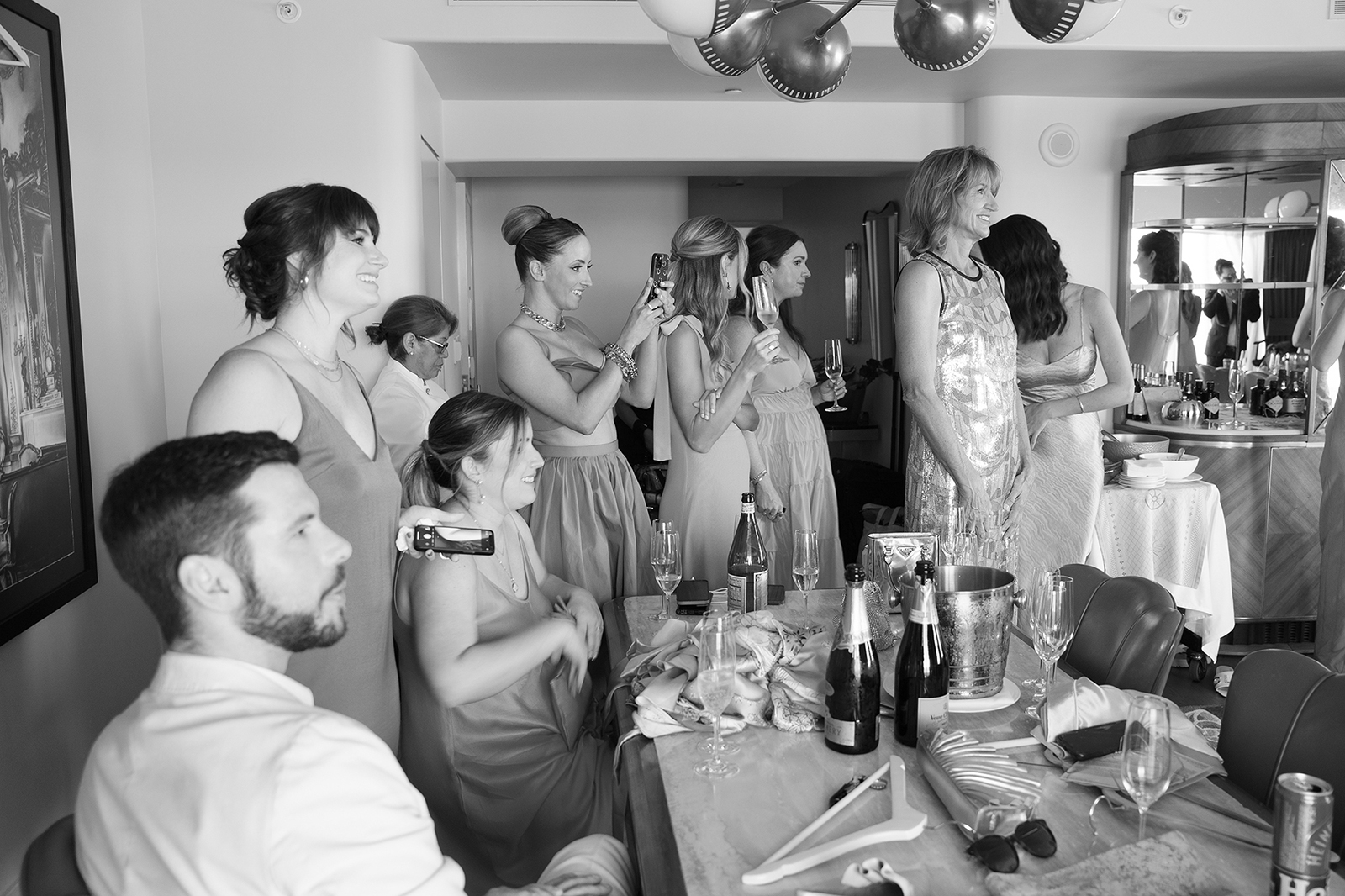 wedding party admiring the bride as she gets ready