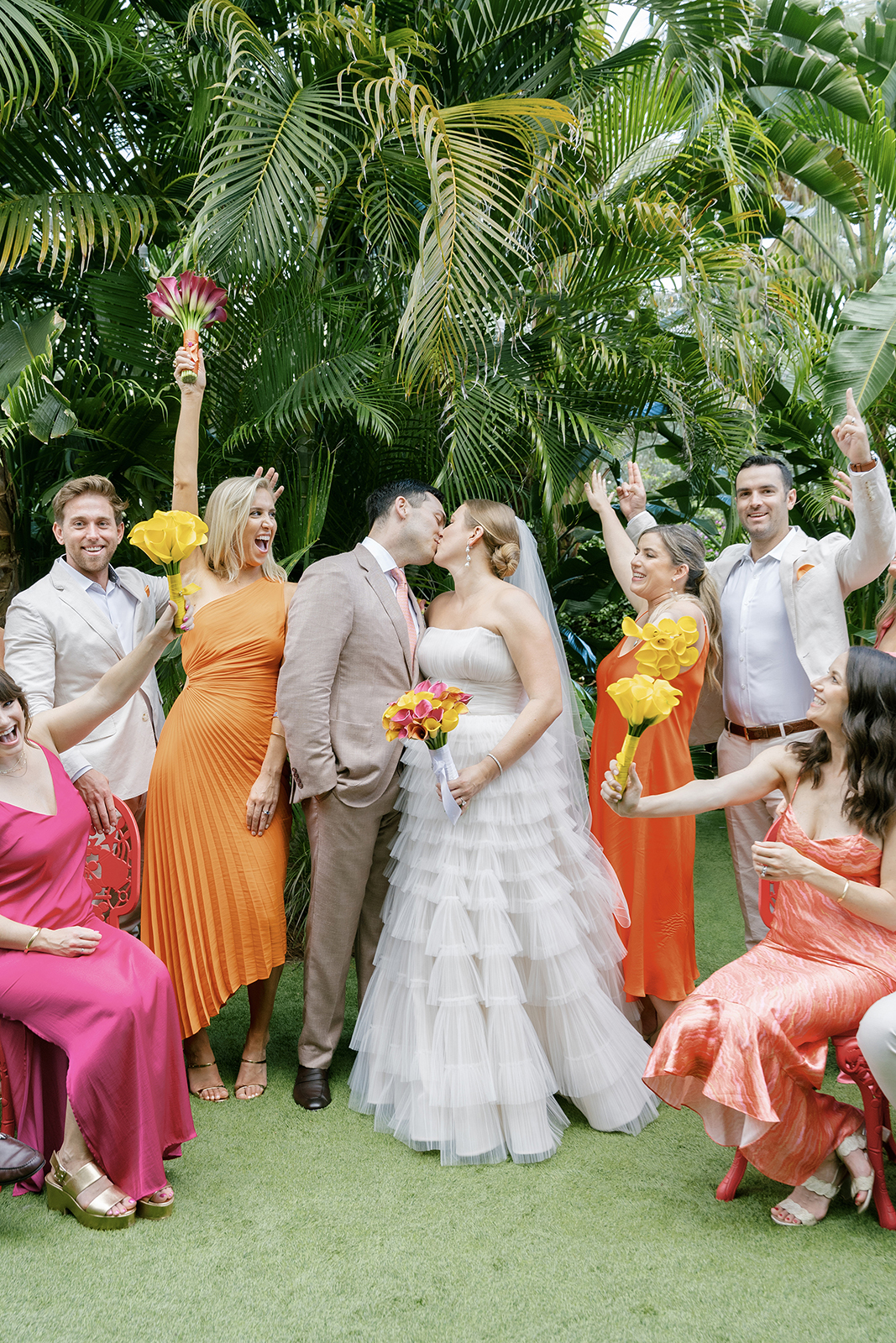 Wedding party celebrating with colorful bouquets during a Faena Hotel Miami Beach wedding