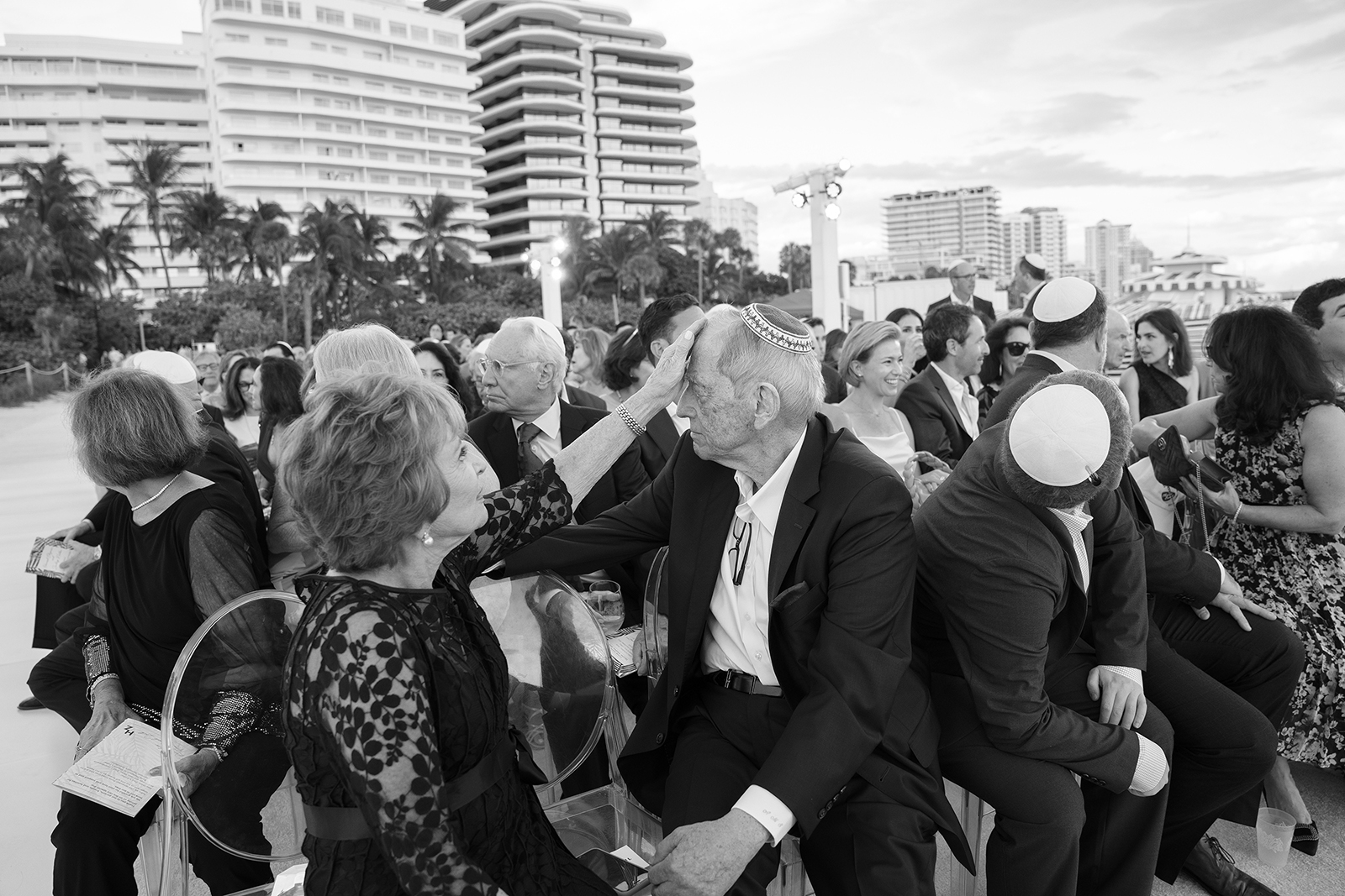 Wedding guests seated during an outdoor ceremony