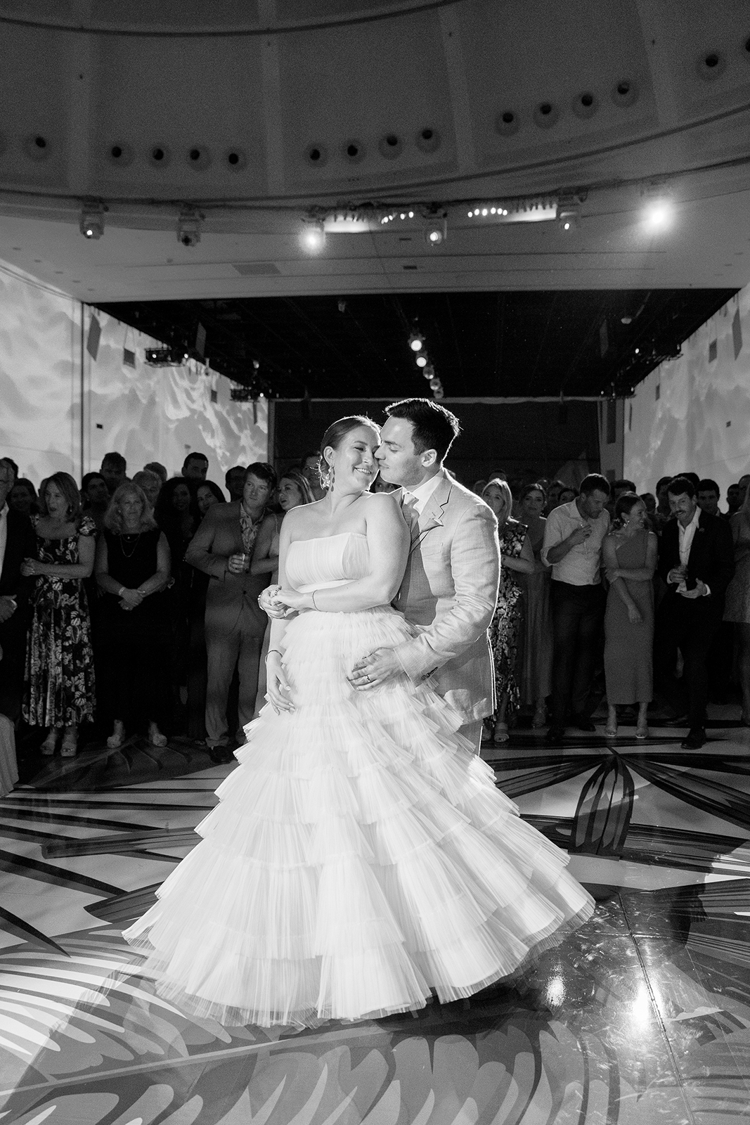 Black and white photograph of a couple’s first dance at their Faena Miami Beach wedding reception.