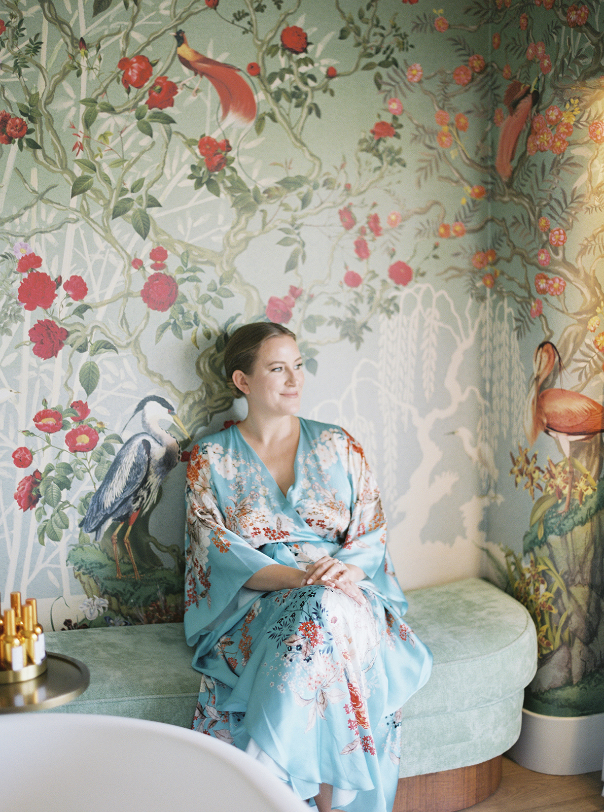 Bride getting ready in a silk robe inside Faena Hotel Miami Beach before her wedding day