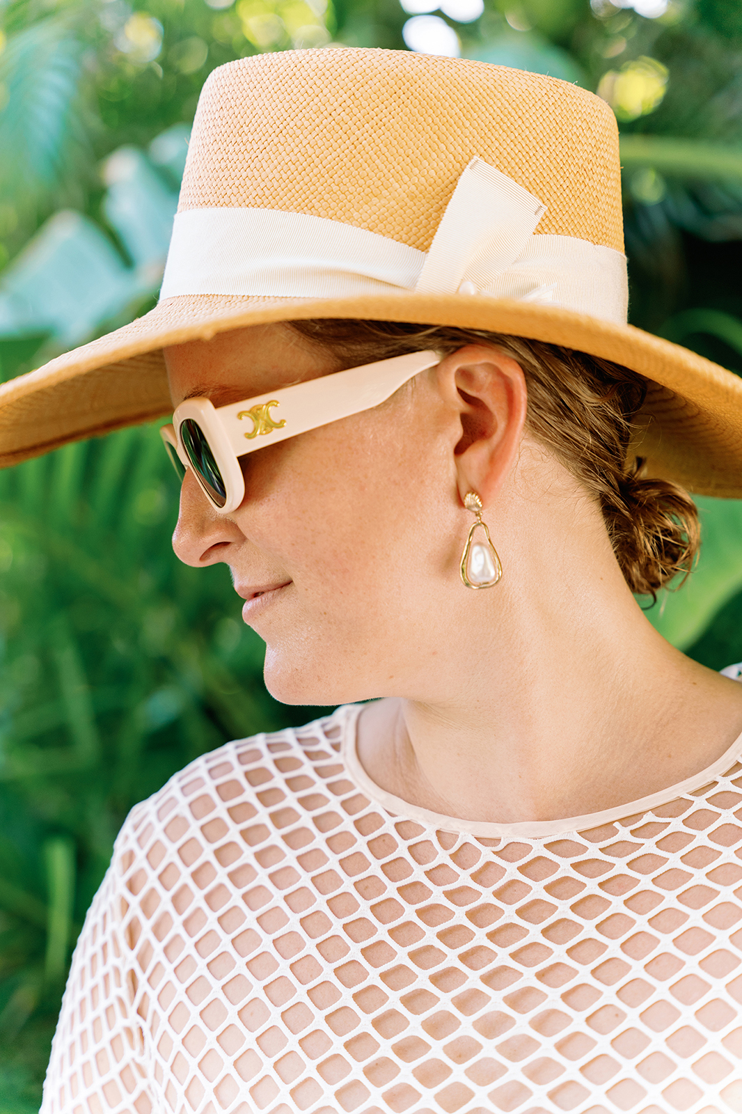Bride wearing a stylish cover-up and sunglasses during a Faena wedding weekend