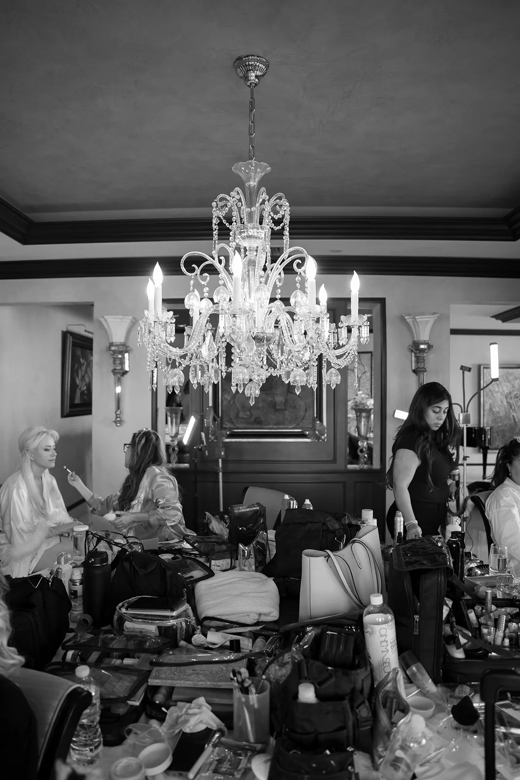 Bride having final makeup touches in a luxury getting-ready suite before her Fisher Island wedding