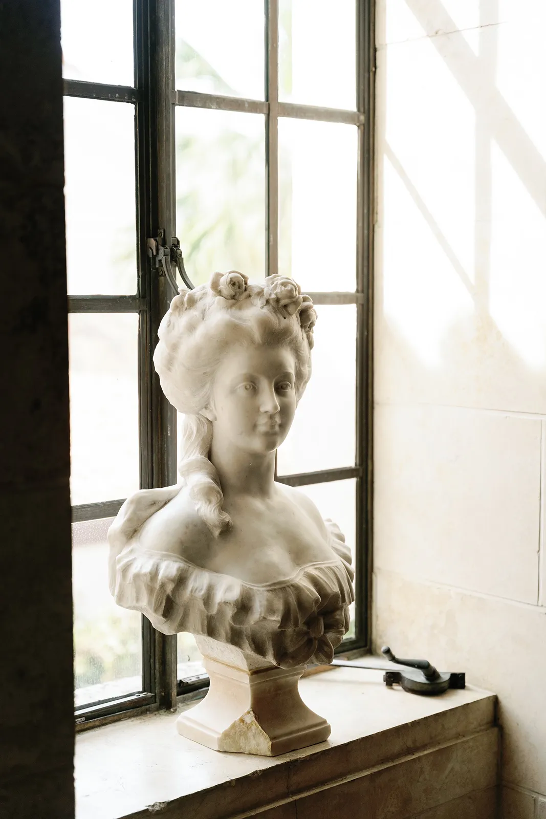 Classic marble statue detail inside a historic Fisher Island wedding venue