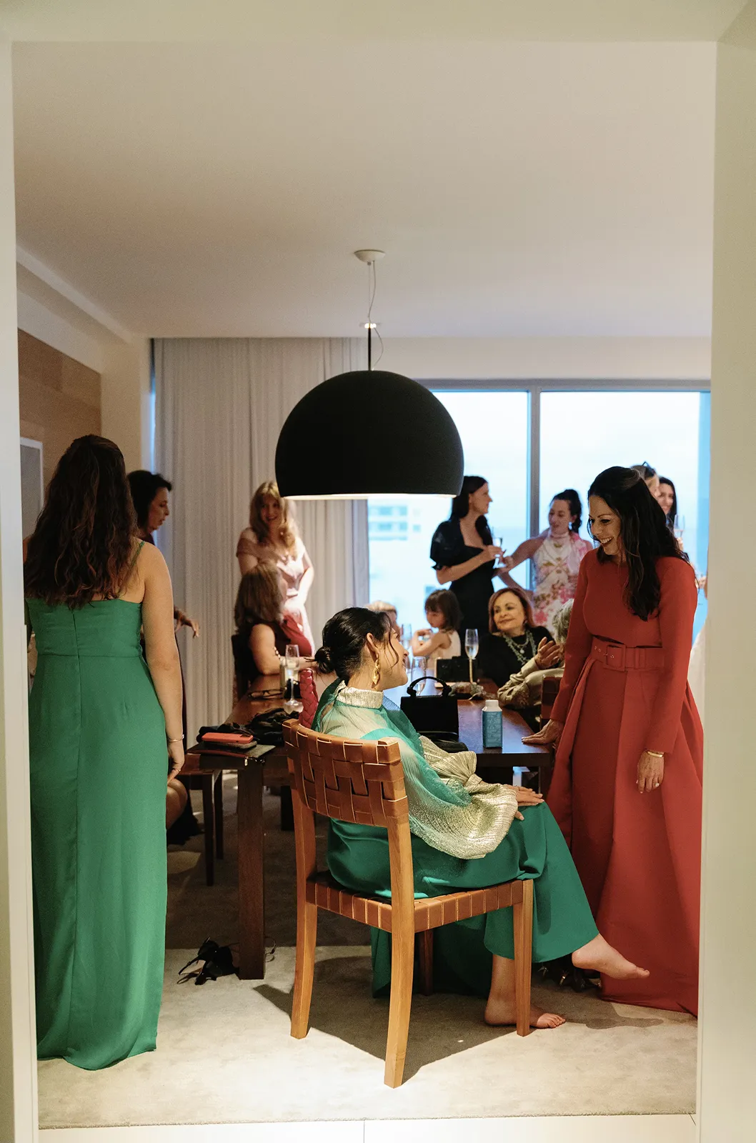 Wedding party gathered in a hotel suite during getting ready moments before the ceremony