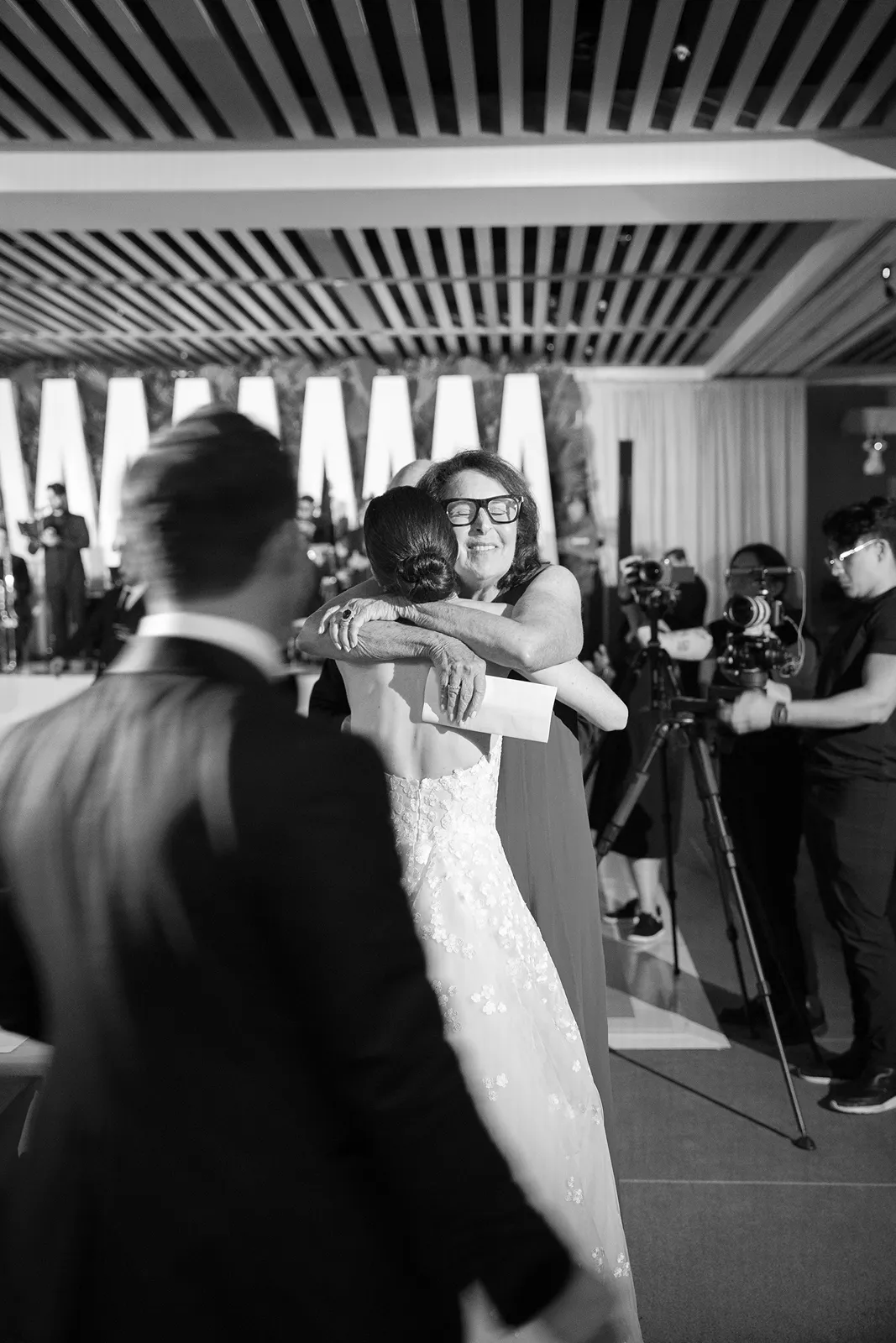 Bride hugging her mother during the reception at The Miami Beach EDITION wedding celebration