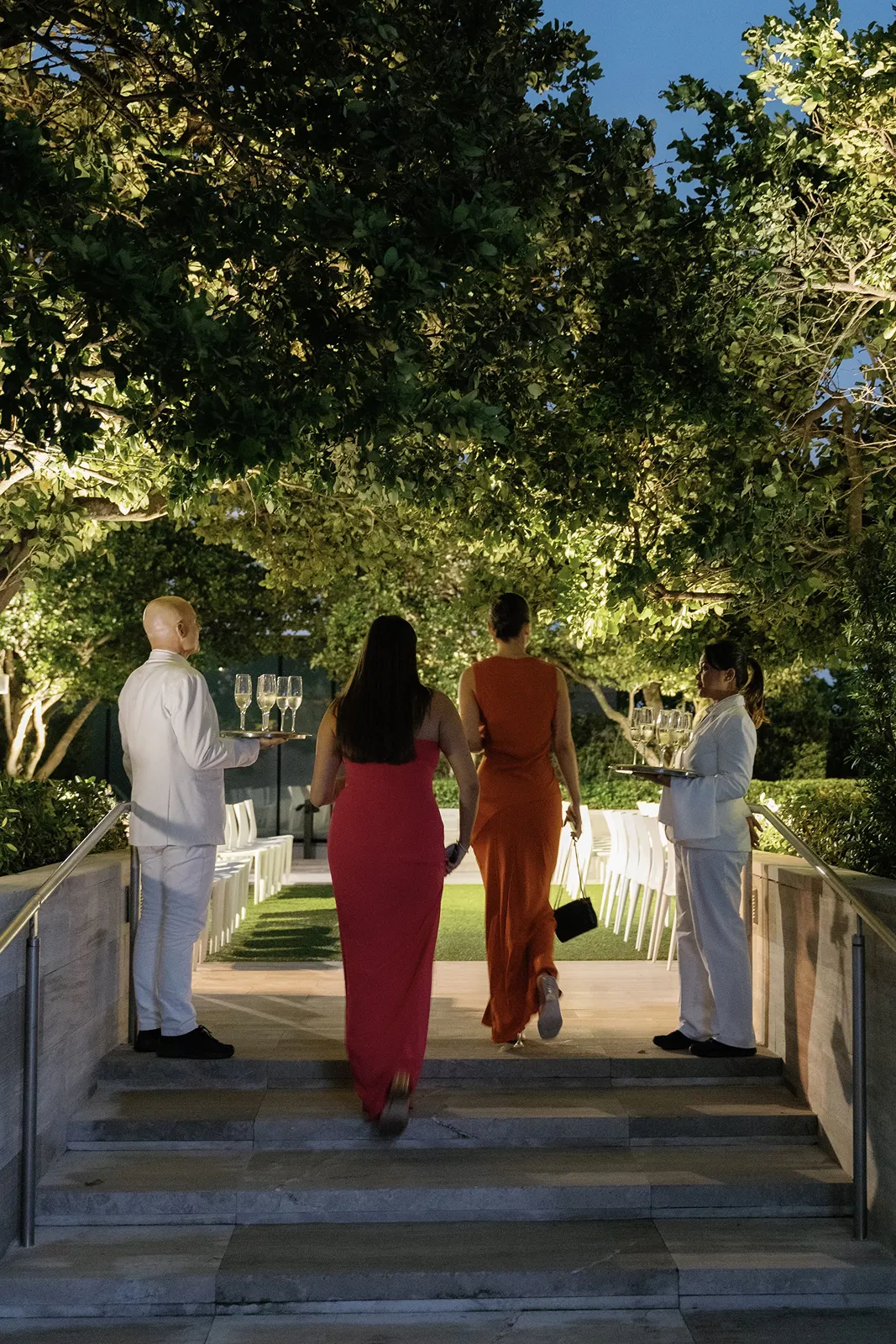 Guests arriving for an outdoor evening celebration at The Miami Beach EDITION wedding