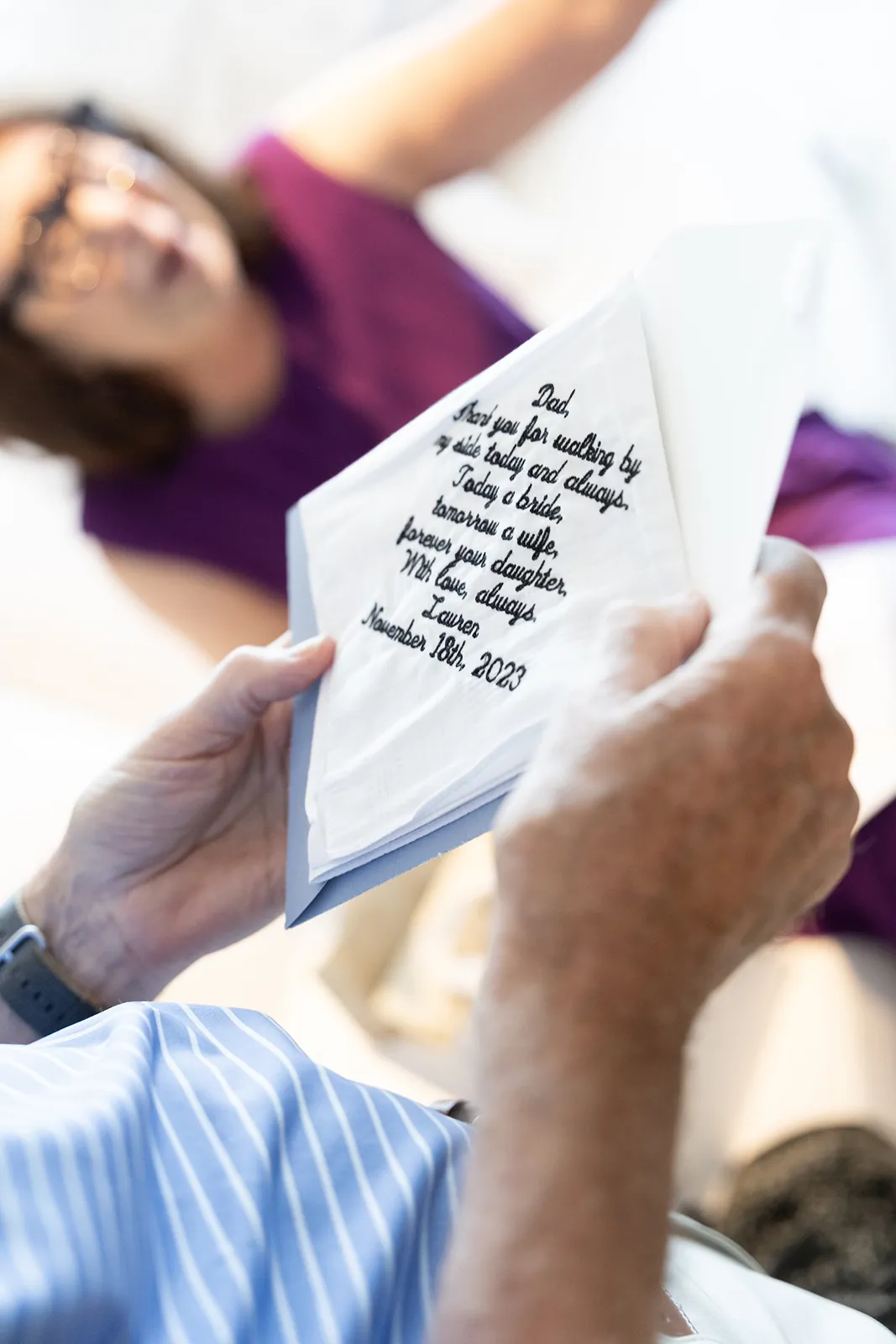 Father reading a handwritten note during emotional getting ready moments at The Miami Beach EDITION