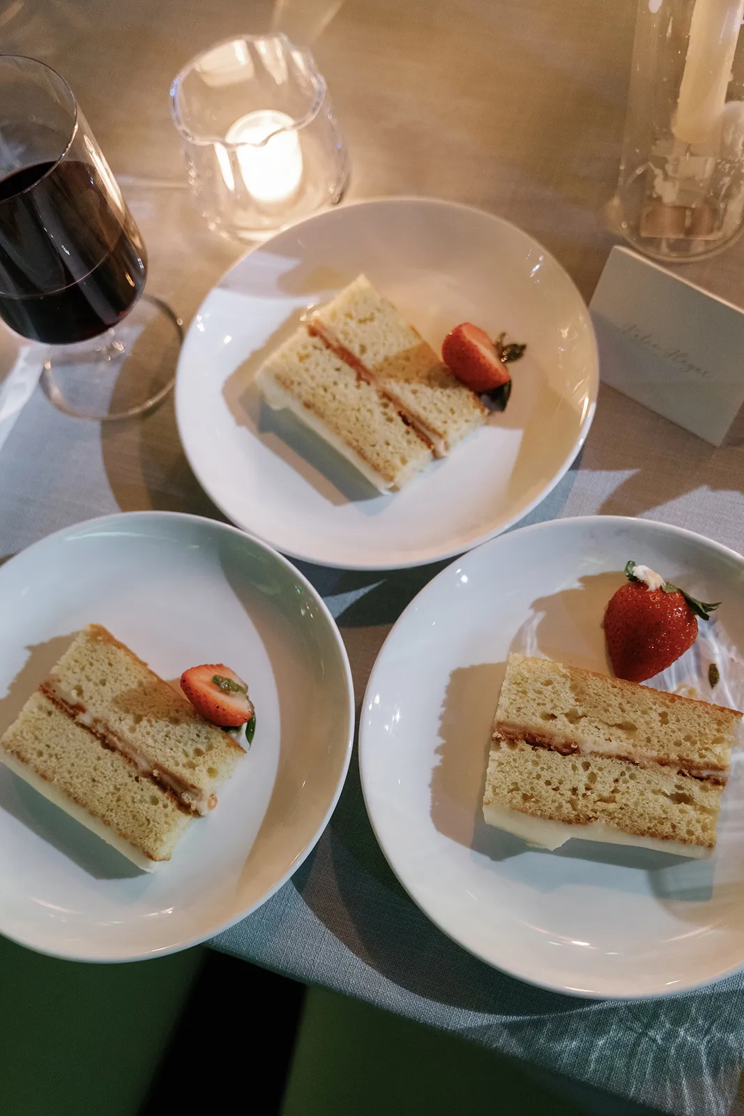 Wedding cake slices served on plates during the reception at The Miami Beach EDITION