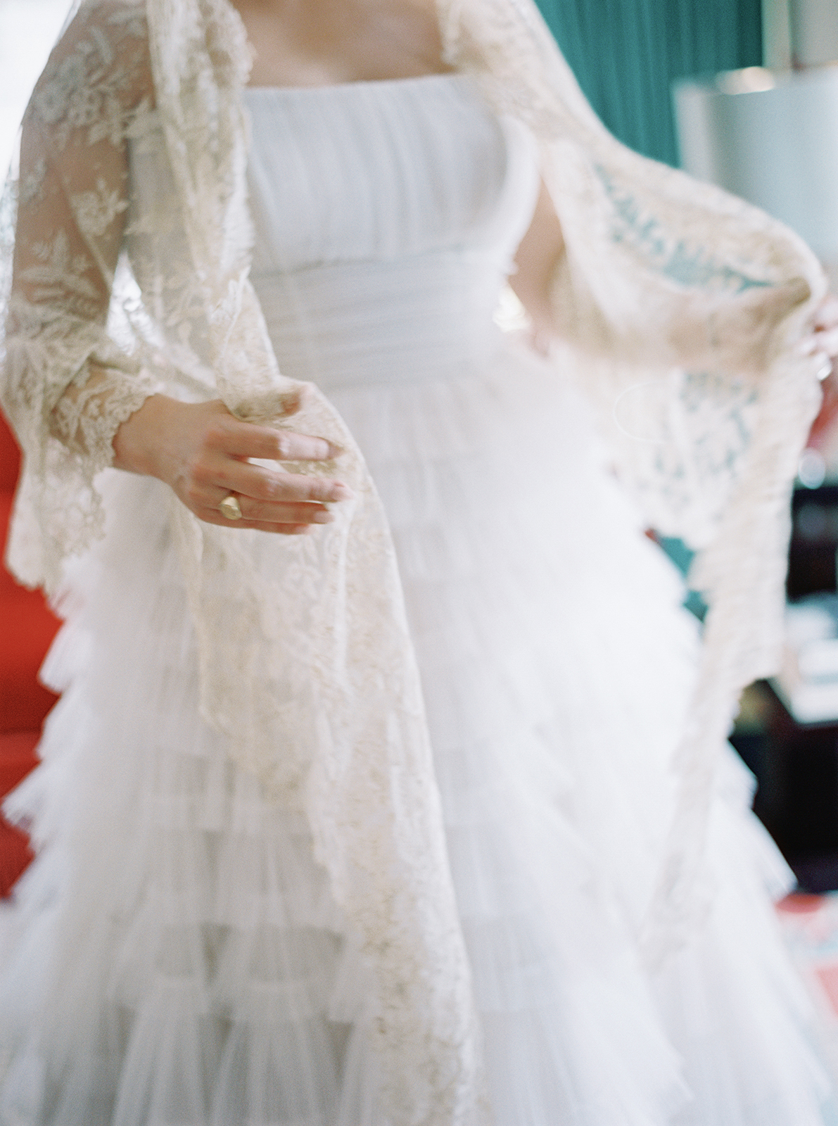 bride putting on her great grandmother's wedding veil 