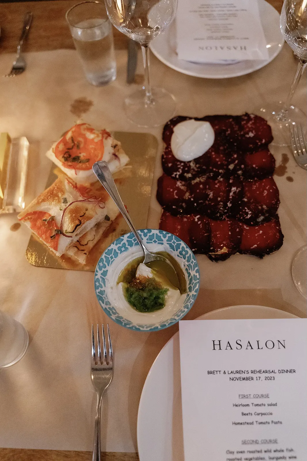 Shared plates and small dishes served during a wedding rehearsal dinner at Hasalon Miami Beach
