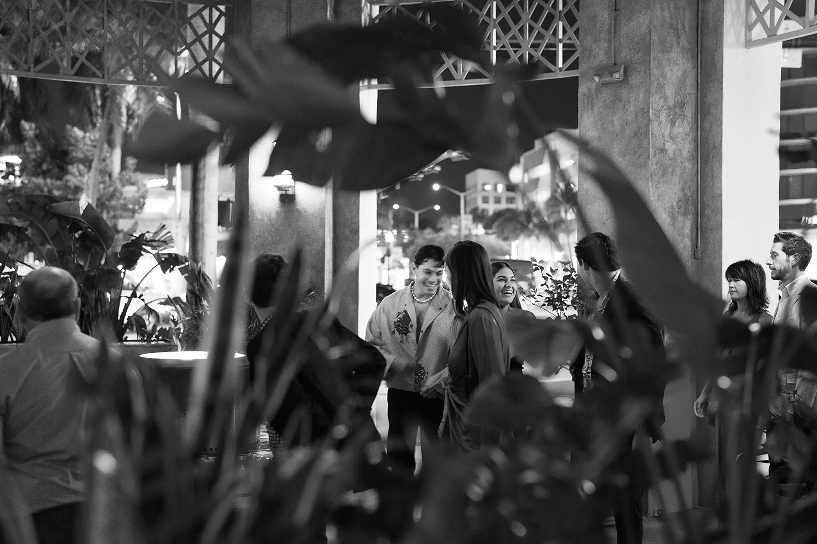 Lively crowd gathered inside Hasalon Miami Beach during a wedding rehearsal dinner